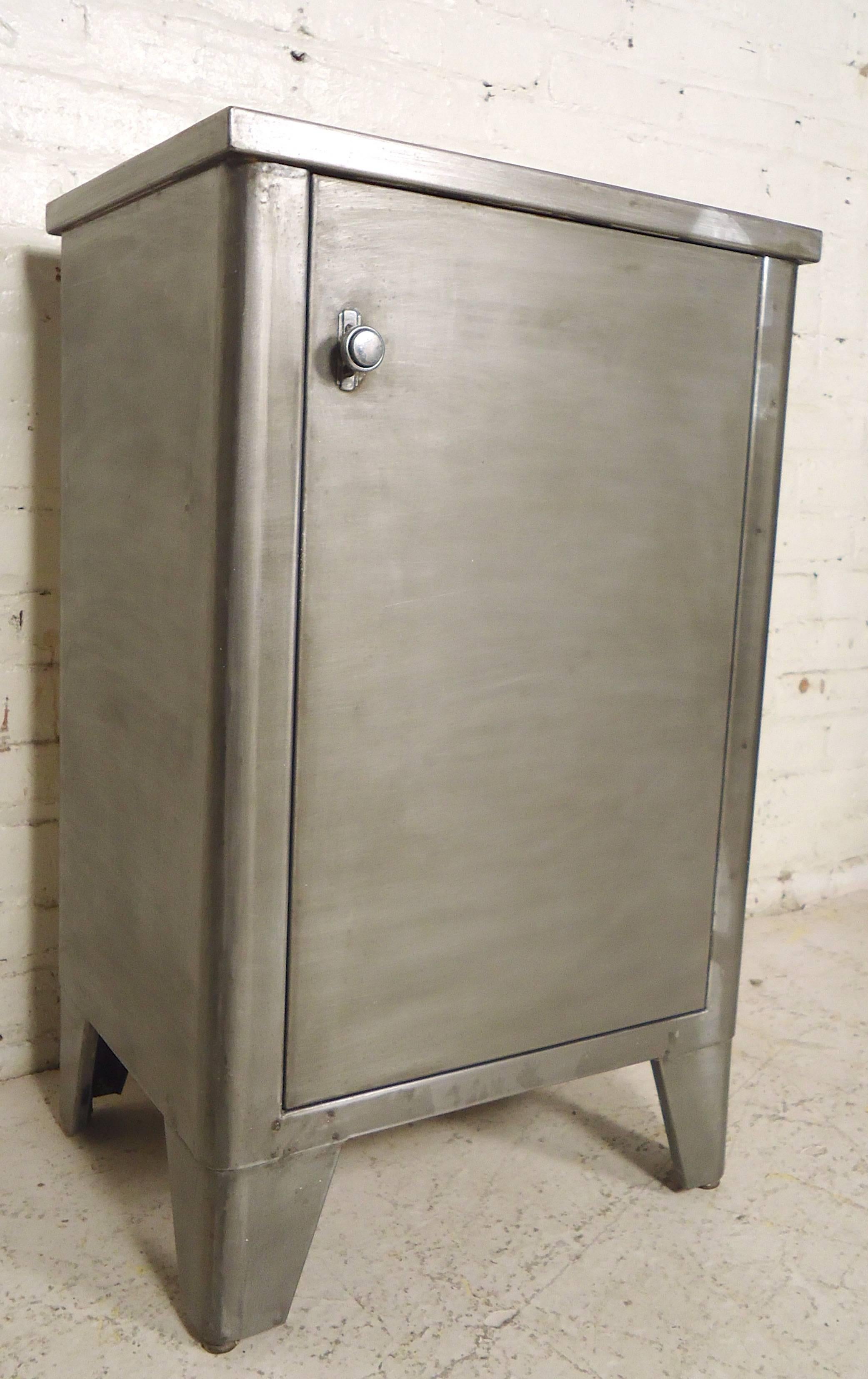 Industrial metal cabinet restored in a bare metal style finish. Unique push button lock, removable shelves. Great as bathroom storage or bedside table.

(Please confirm item location - NY or NJ - with dealer).
 