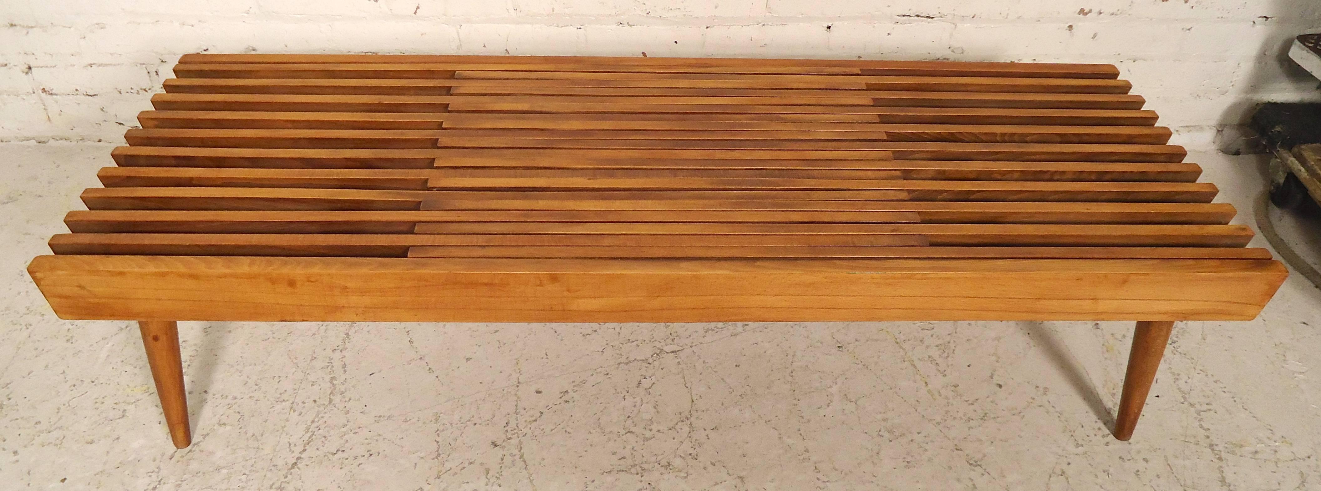Great vintage modern slat bench in walnut. Extends to six feet long. Each side extends for various lengths. Makes a great bedside or entry way bench.

(Please confirm item location - NY or NJ - with dealer).
 