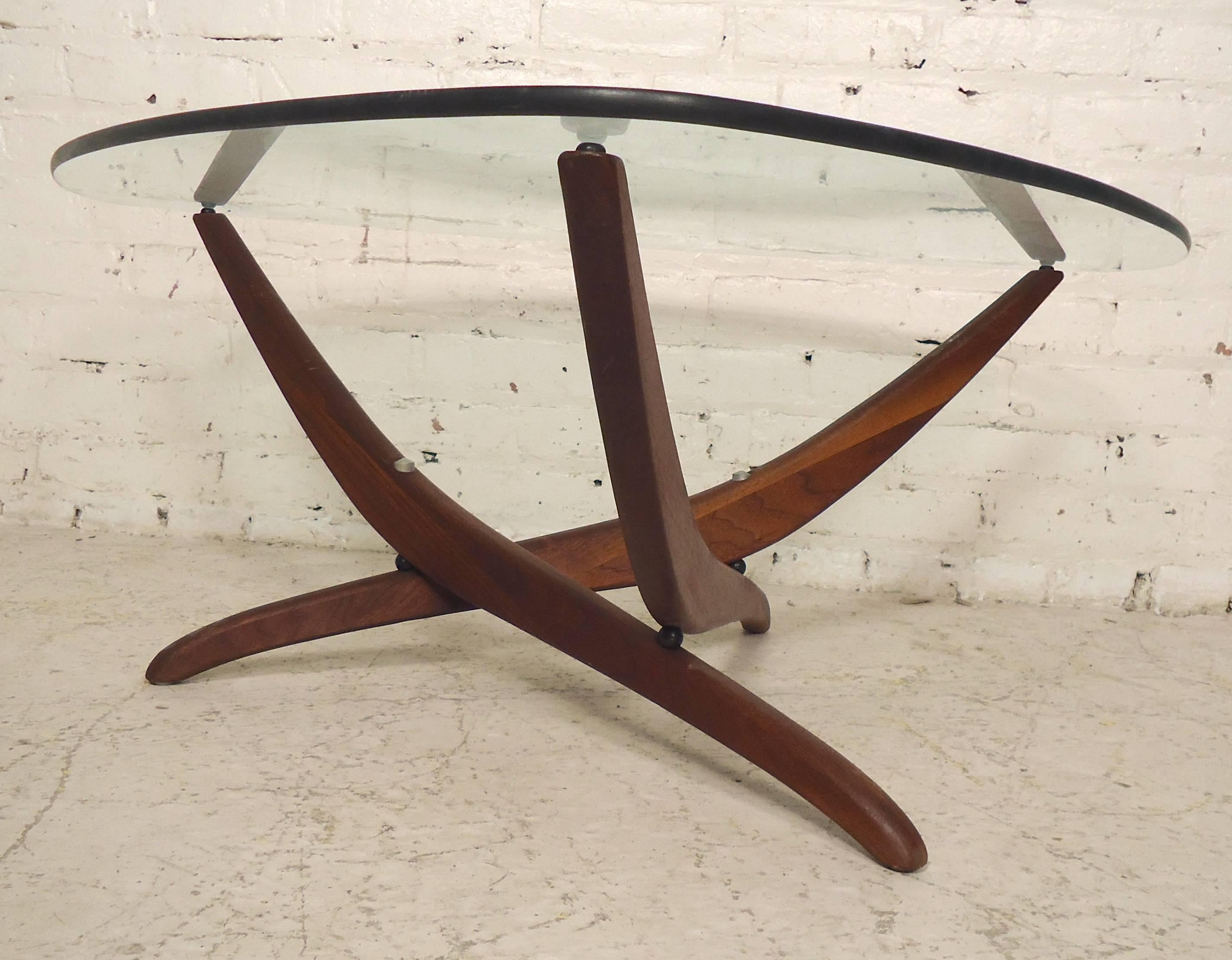 Unusual side table with teak base and glass top, reminiscent of Noguchi's Mid-Century design.

(Please confirm item location - NY or NJ - with dealer).
 