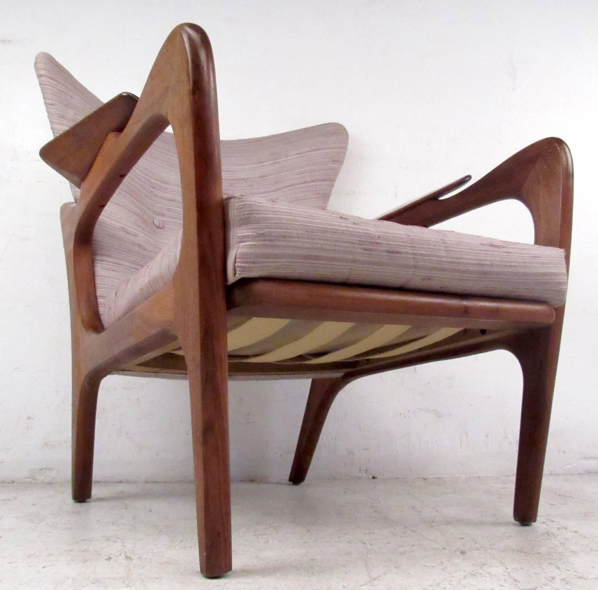 Vintage-modern lounge chair featuring sculpted body and upholstered seat and back, designed in the manner of Adrian Pearsall.

Please confirm item location NY or NJ with dealer.