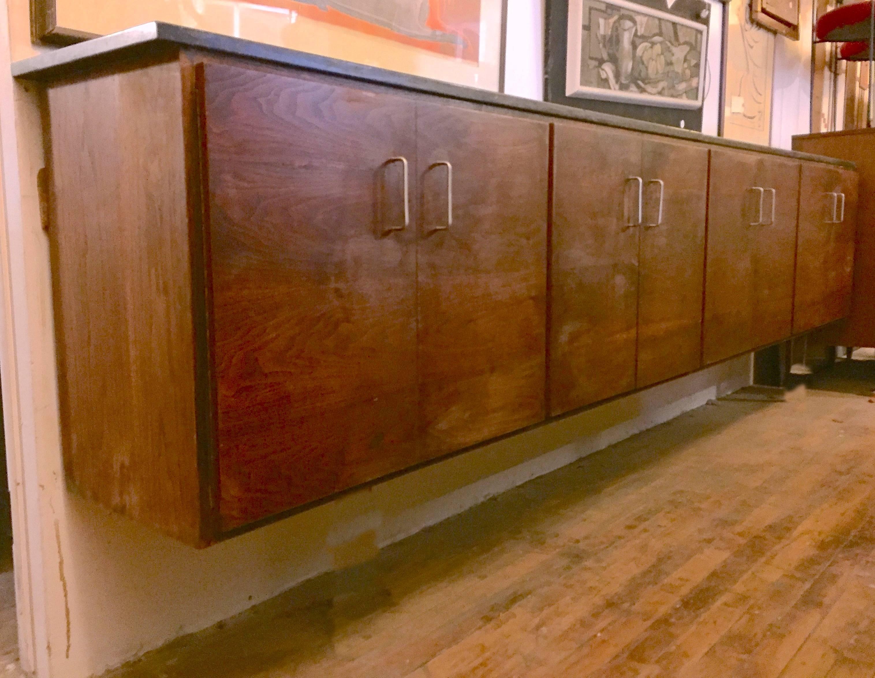 Mid-Century Modern wall-mount cabinet with black marble top and rich rosewood grain. Four storage cabinets with drawers and shelving.

(Please confirm item location - NY or NJ - with dealer).
     