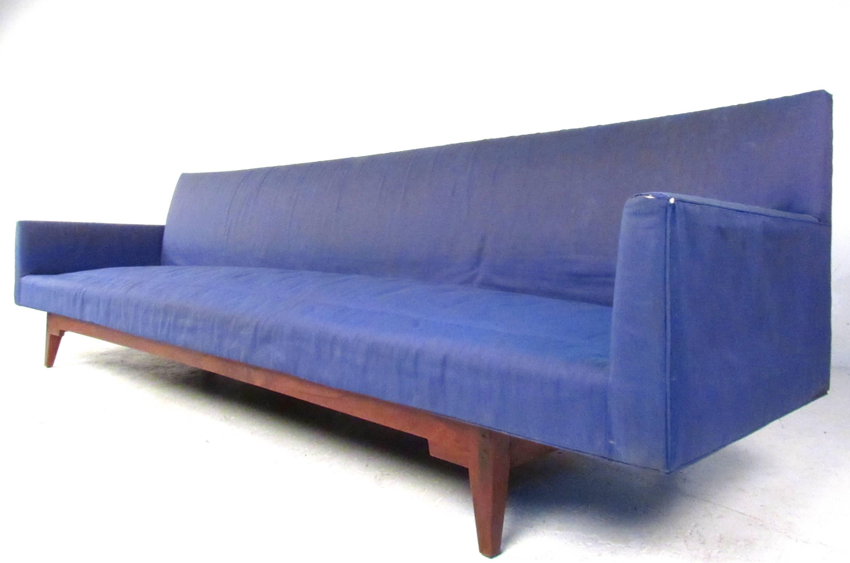 This large-scale sofa measures over 9 feet long and makes a unique and stylish seating addition to any interior. Comfortable and stunning in it's size and simplicity, the design by Jens Risom's 