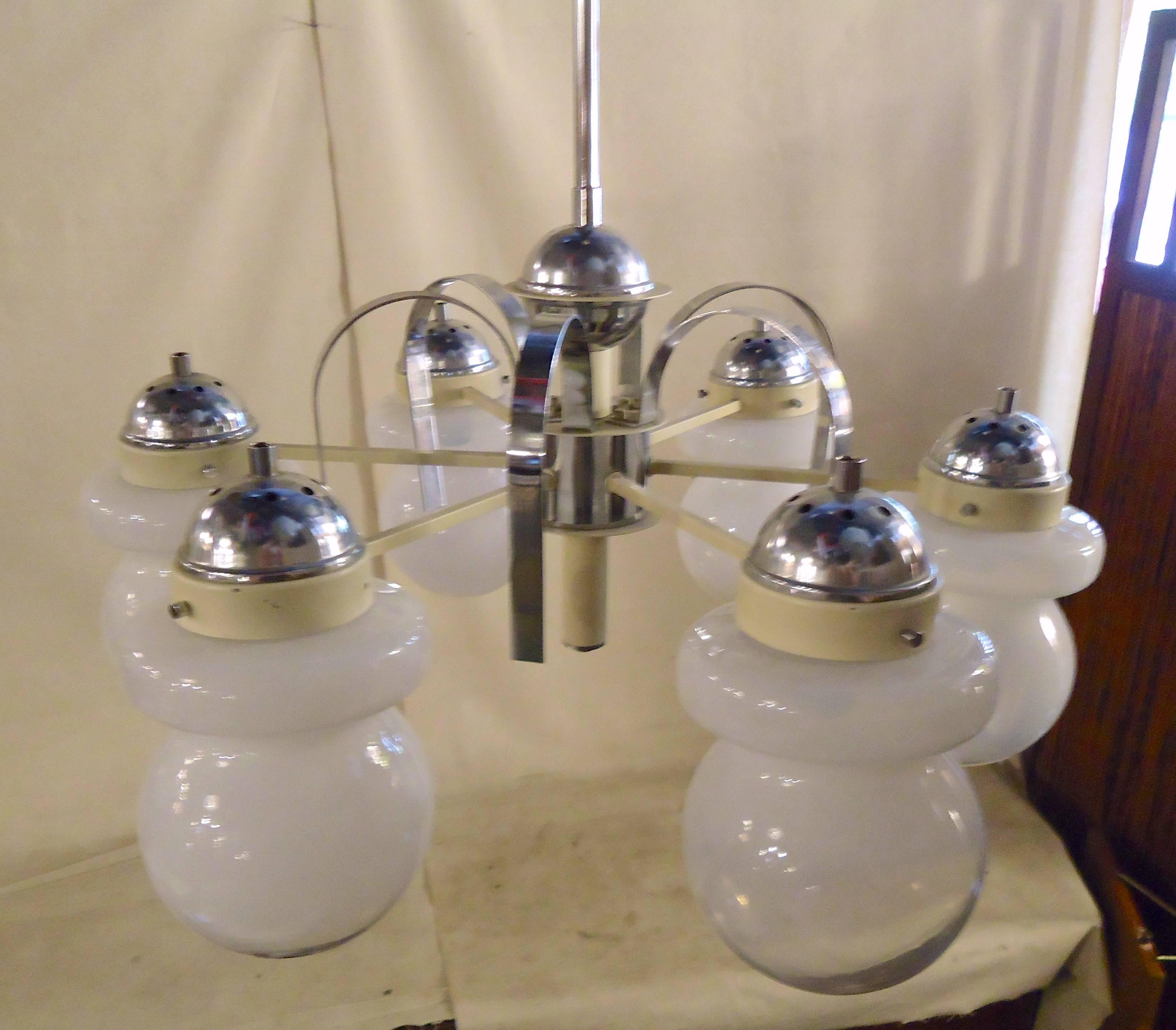 Chrome frame chandelier with six glass globes. Long stem, chrome decorative bands, white frosted globes.

(Please confirm item location - NY or NJ - with dealer).
 