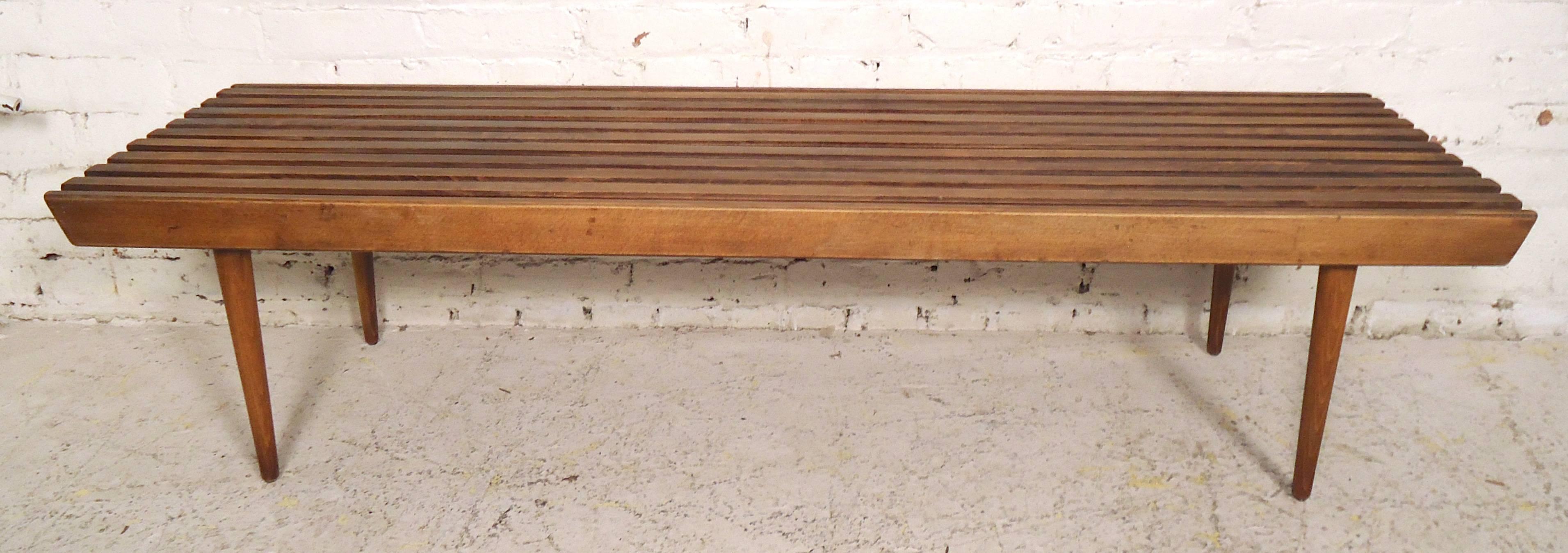 Attractive slat bench/table with walnut grain and tapered legs. Great for living room, entry way or as a bedside bench.

(Please confirm item location - NY or NJ - with dealer).
 