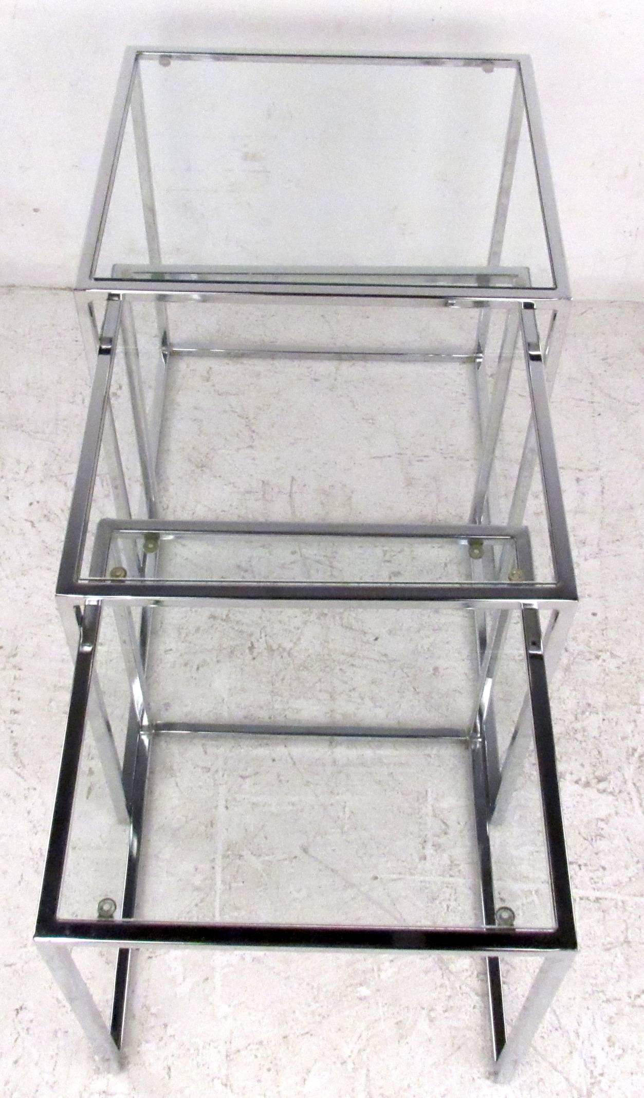 Vintage-modern nesting tables featuring chrome frames with glass tops, designed in the manner of Milo Baughman.

Dimensions: 17.75 W 19.75 D 20.25 H.
 16.75 W 17.75 D 18.75 H.
 15.75 W 16 D 16.75 H.

Please confirm item location NY or NJ with