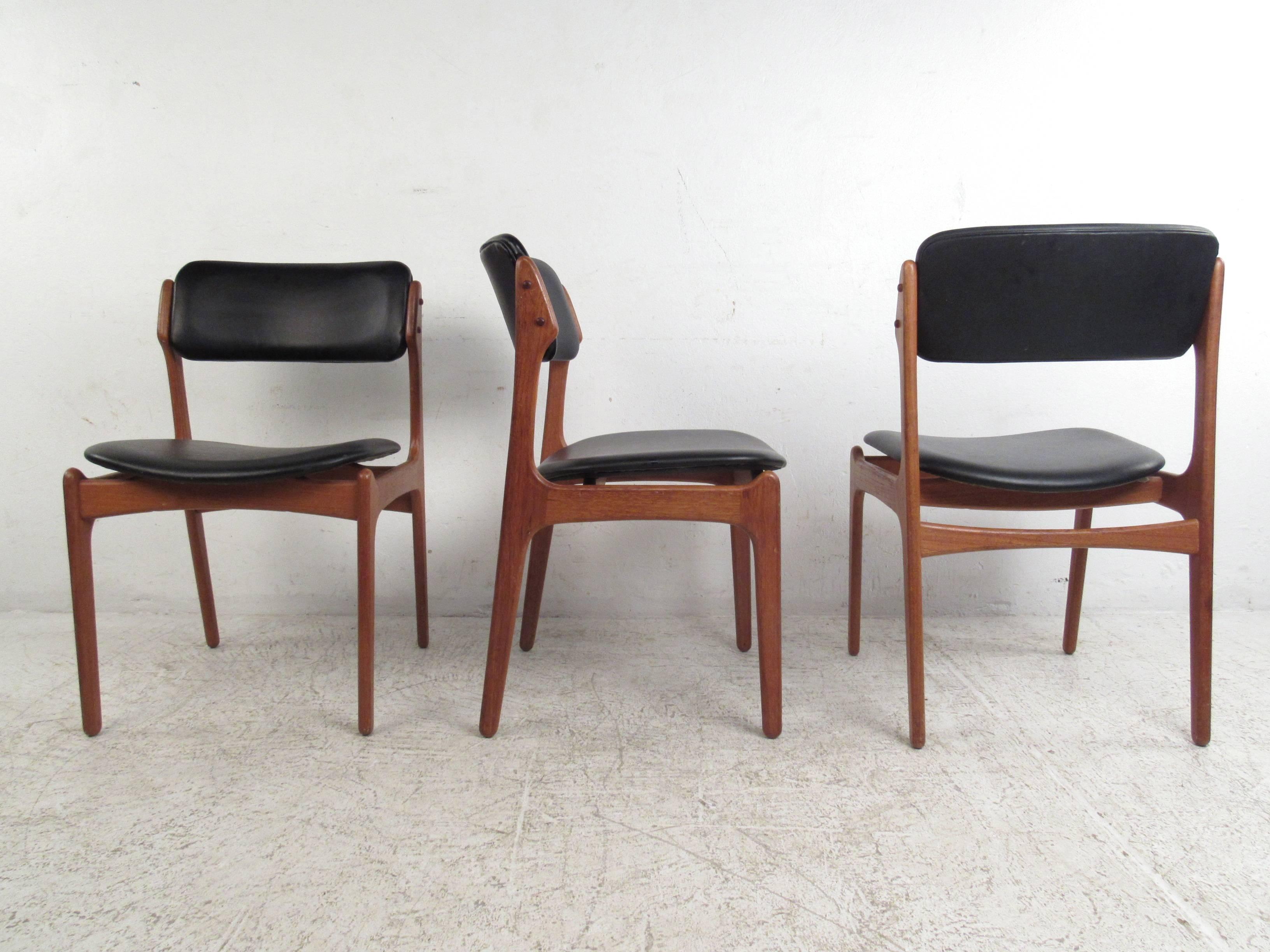 This set of six vintage dining chairs offers Eric Buck's unique combination of simplistic style and irrefutable comfort. Lovely tapered teak frames complete with durable vinyl upholstery make this unique set the perfect compliment to any modern