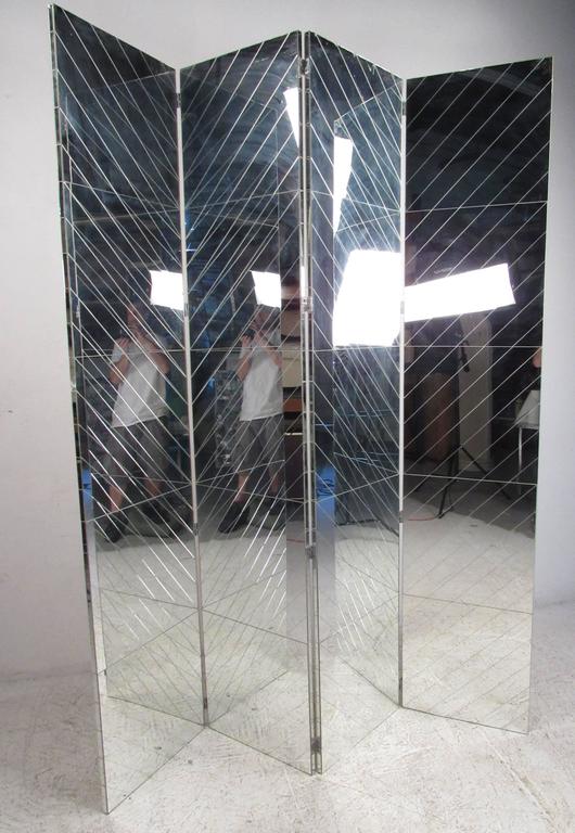 This uniquely large glass mirrored room divider features an impressive ninety inch height across four textured mirrored panels. Creating an adjustable wall panel perfect for home or business use, this mid-century mirrored room divider makes a