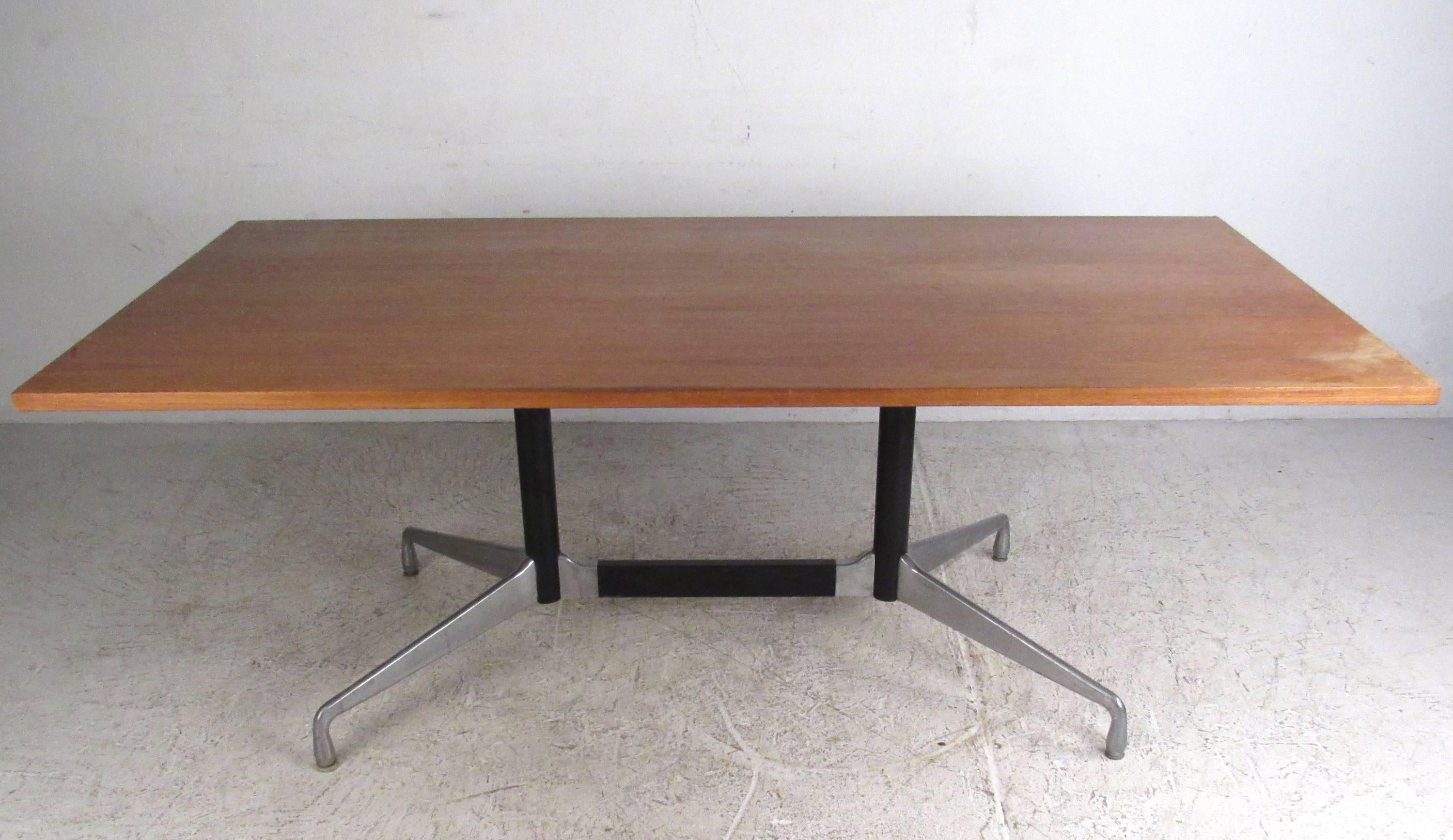 This unique vintage dining or conference table features the unique vintage design of Charles Eames. Aluminum base sturdily supports the large rectangular top it's been paired with. Please confirm item location (NY or NJ).