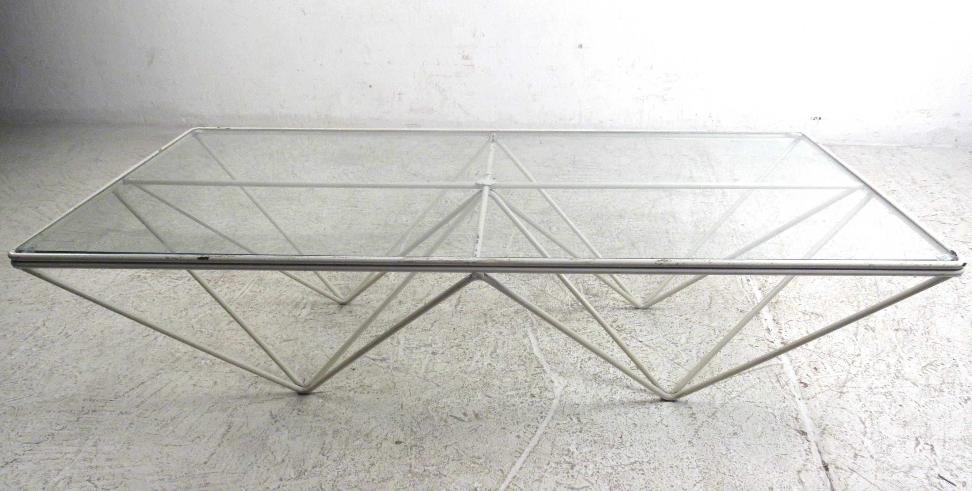 The unique modern design sets apart this metal frame geometric coffee table, making it a visually impressive addition to any seating area. Please confirm item location (NY or NJ).