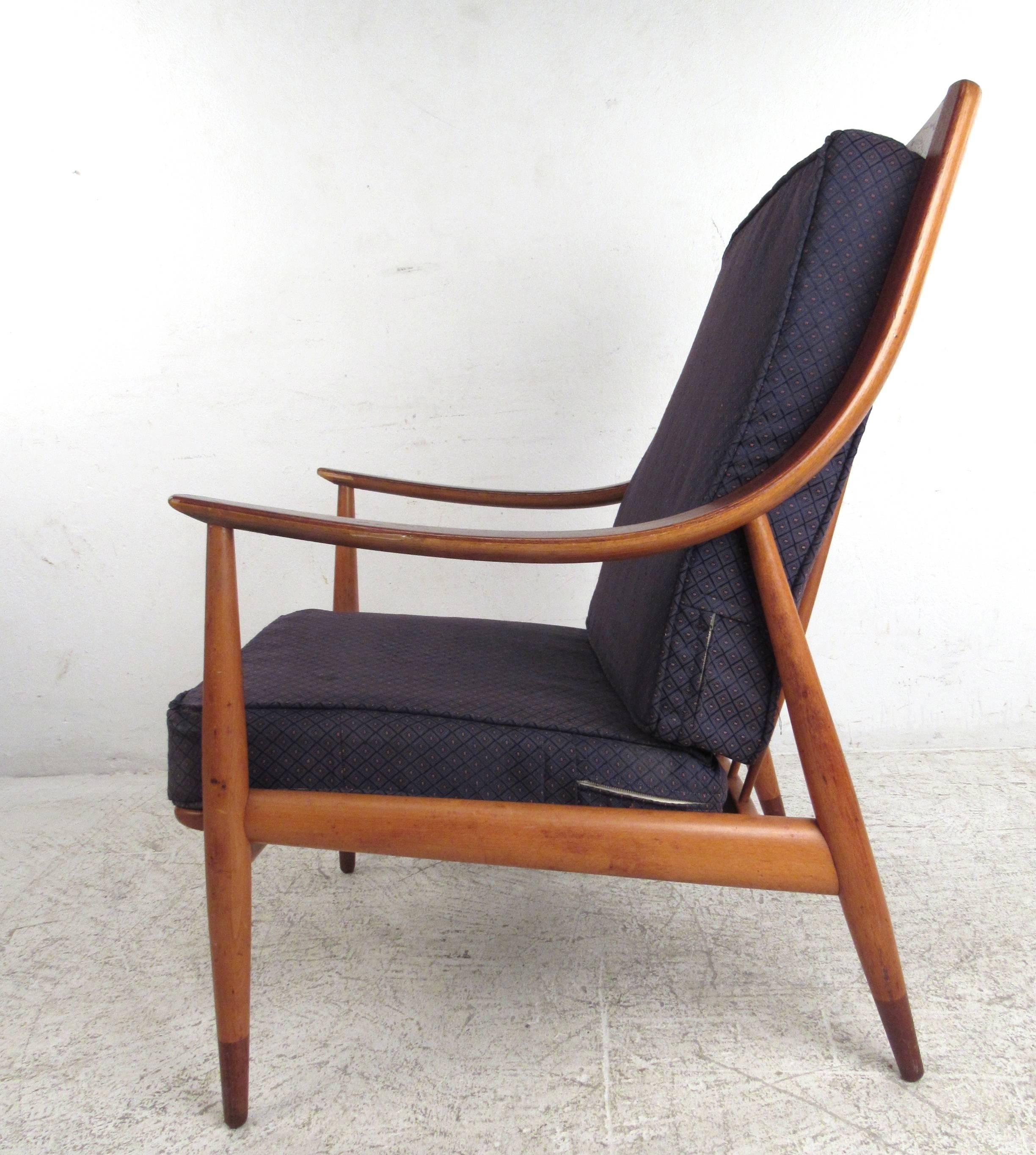 Bring home a fantastic example of Danish mid-century modern design with the highly collectible FD-146 easy chair by Peter Hvidt and Orla Mølgaard-Nielsen.  Distributed in the American market for John Stuart Inc, this chair features a variety of
