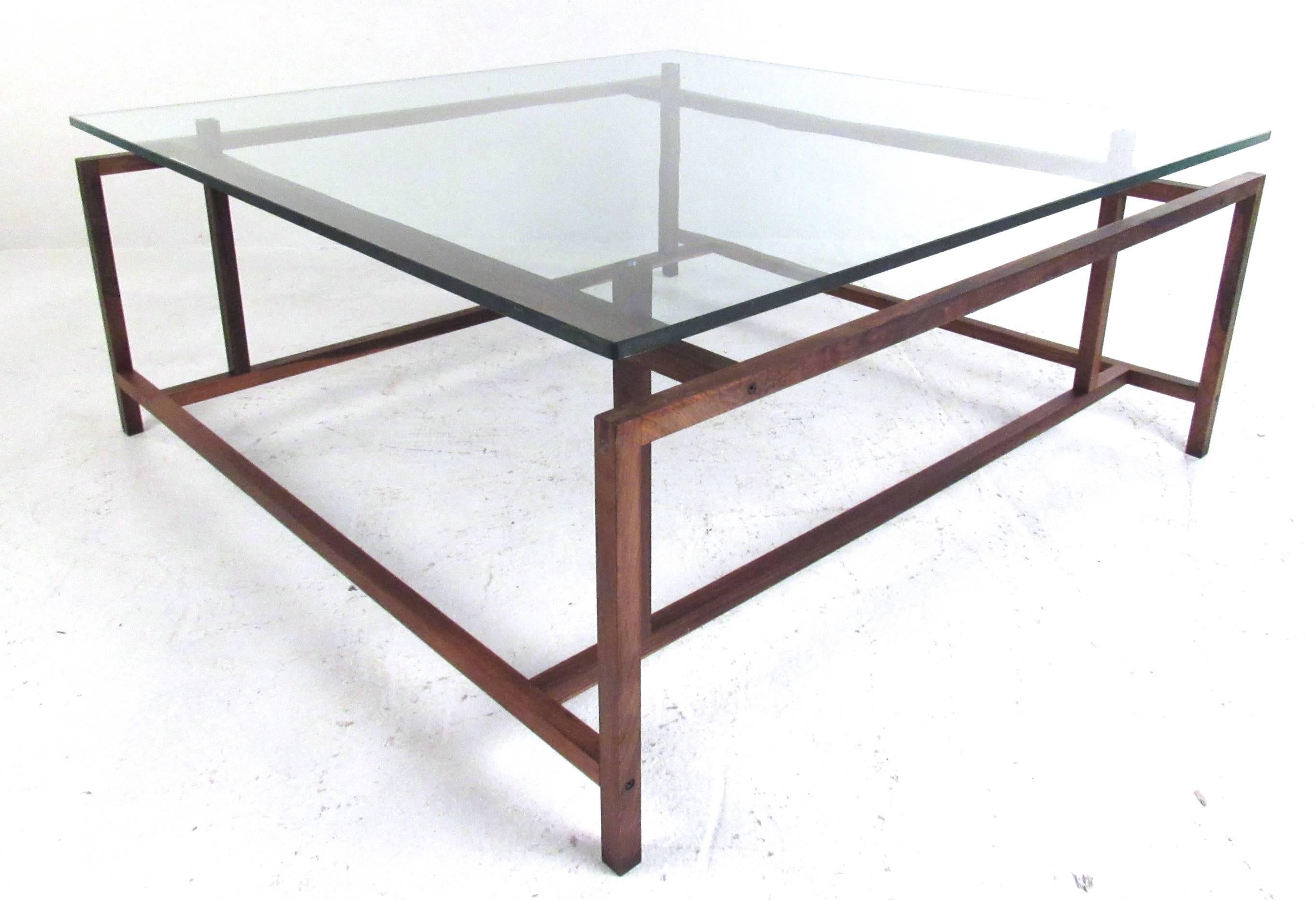 The clean simple lines of this Mid-Century Danish rosewood coffee table features the unique designs of Henning Norgaard. Quality craftsmanship with dovetailing design details make this an impressive vintage modern addition to any interior. Please