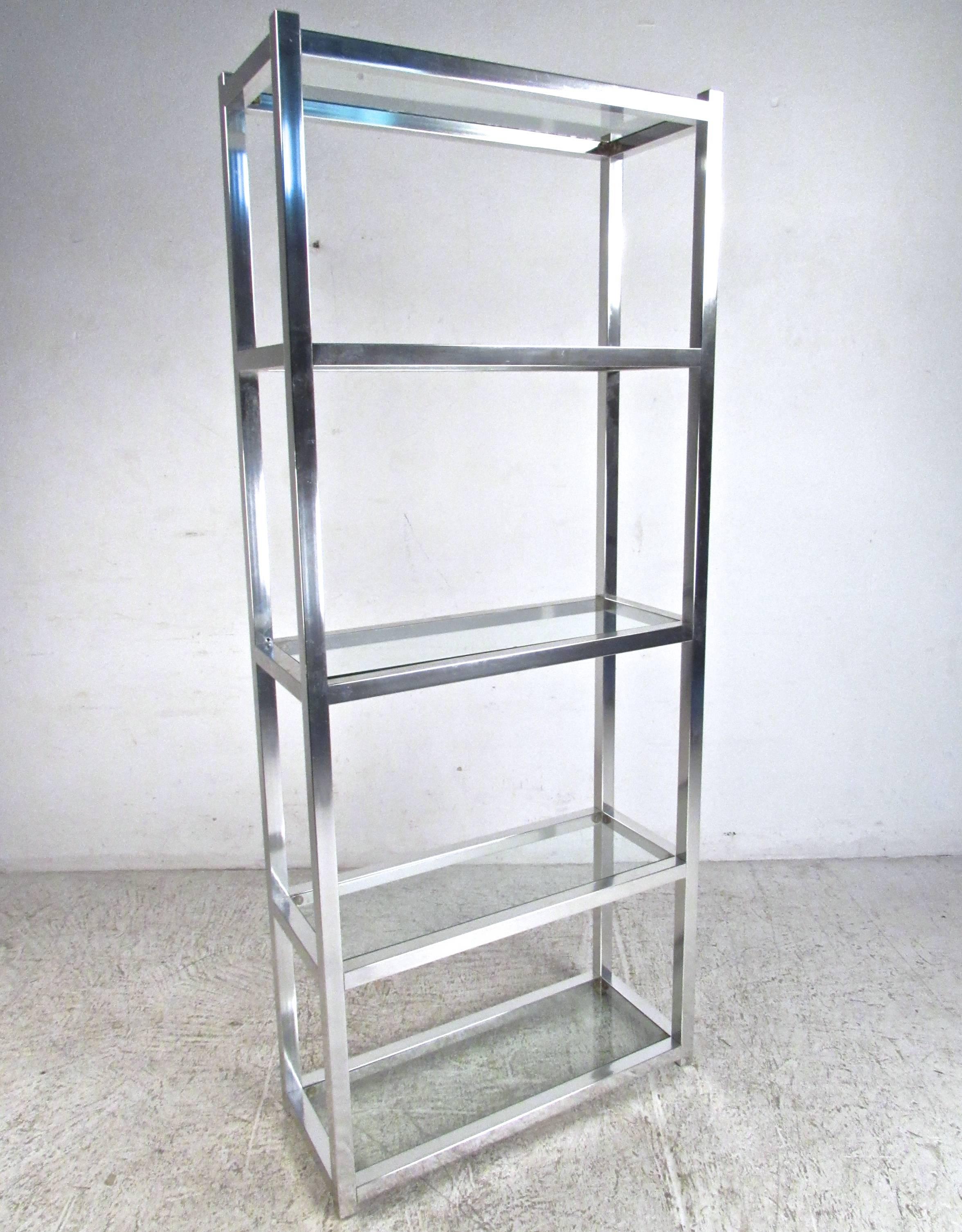 This vintage etagere features five glass inserts and makes a simple yet stylish display piece for home, shop or office. Mid-Century style with plenty of storage/display space makes this a wonderful addition to any interior. Please confirm item
