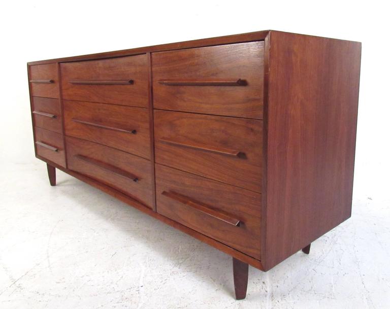 This stunning pair of Mid-Century bedroom dressers features the rich natural finish and sculpted drawer pulls in the style of the George Nakashima 