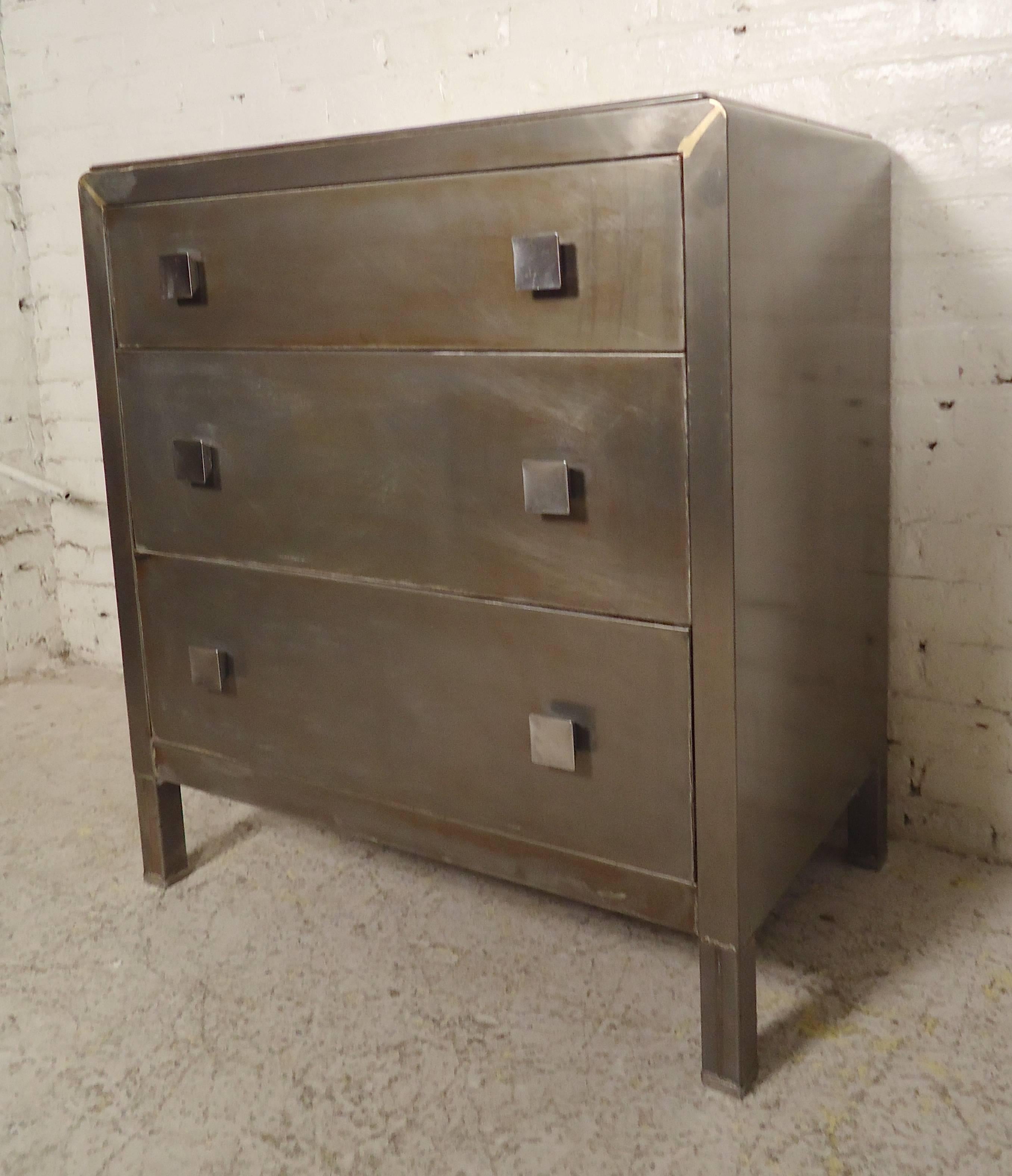 Mid-Century Modern dresser designed by Norman Bel Geddes. Refinished in a bare metal style. Three drawers with square pulls.

(Please confirm item location NY or NJ with dealer).
 