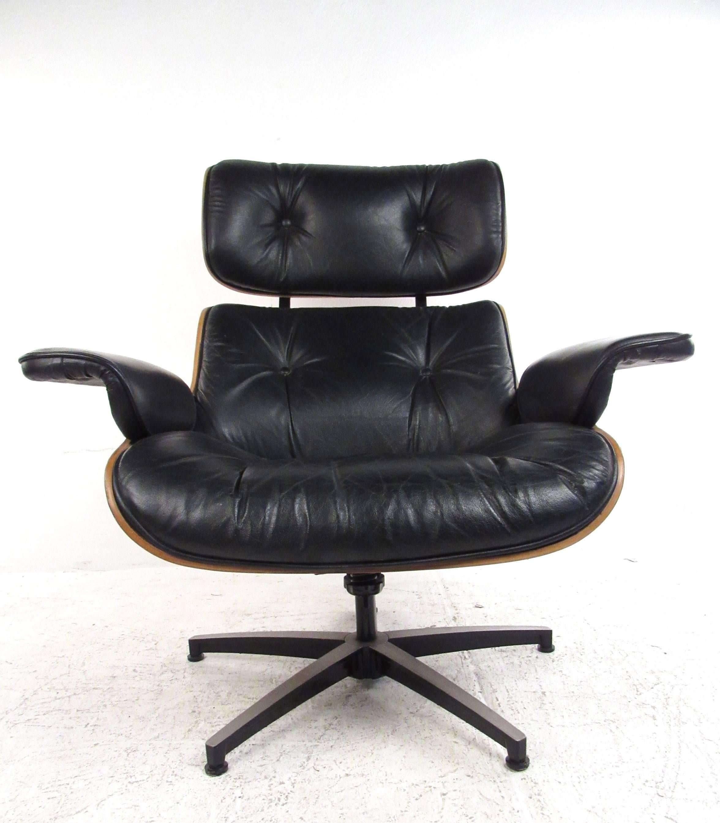 This Herman Miller style lounge chair features Mid-Century style with tufted vinyl upholstery and hardshell frame. Swivel/tilt base adds to the comfort of this plush lounge chair. Please confirm item location (NY or NJ).