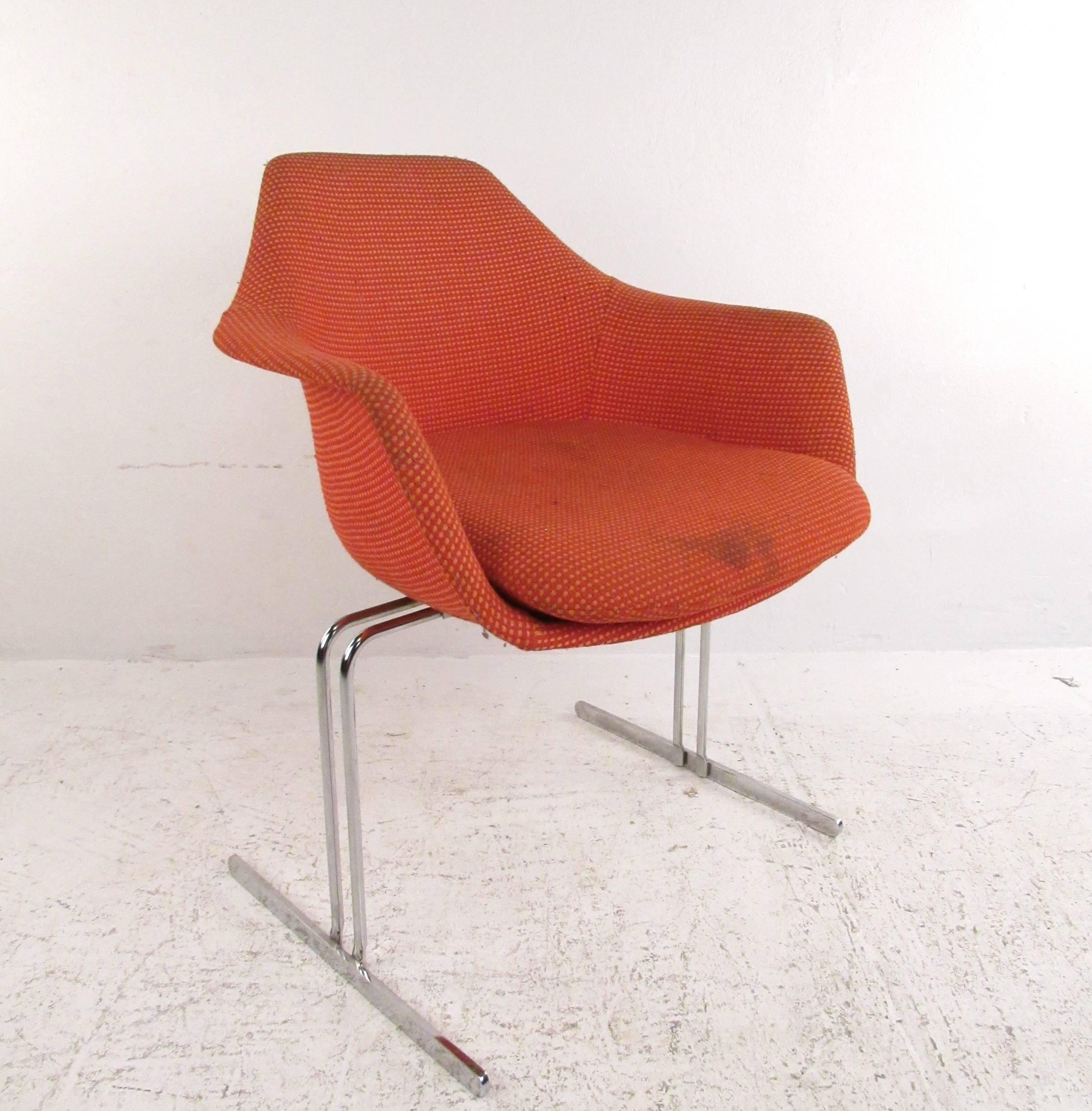 This set of Mid-Century Modern Eero Saarinen style conference chairs features a unique vintage style similar to the Womb chair as sold by Knoll. The unique molded shell design with upholstered frame and t-style chrome base makes for a visually