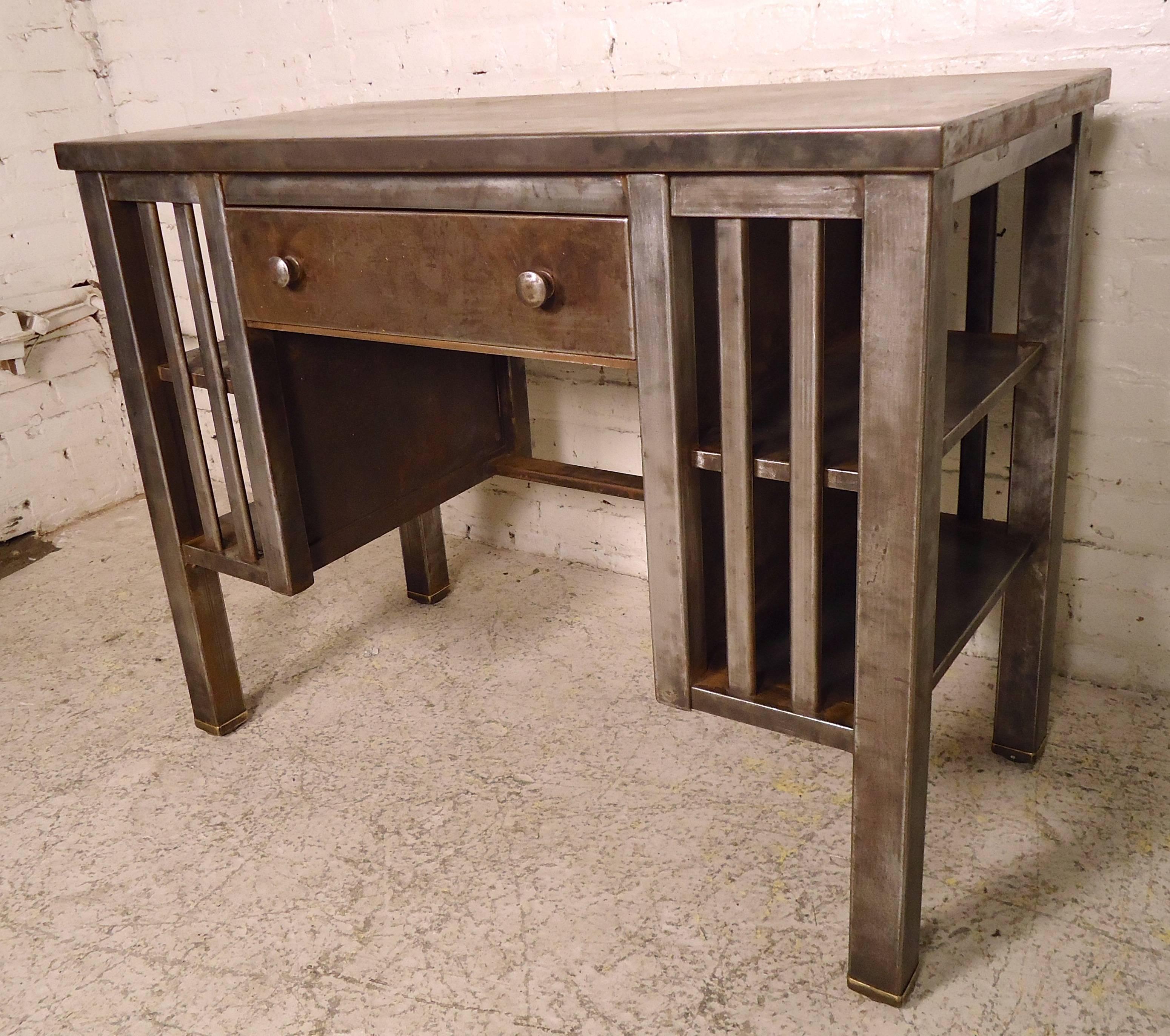 Unusual industrial flat top metal desk, features side shelving units. Completely refinished in a bare metal style.

(Please confirm item location - NY or NJ - with dealer).