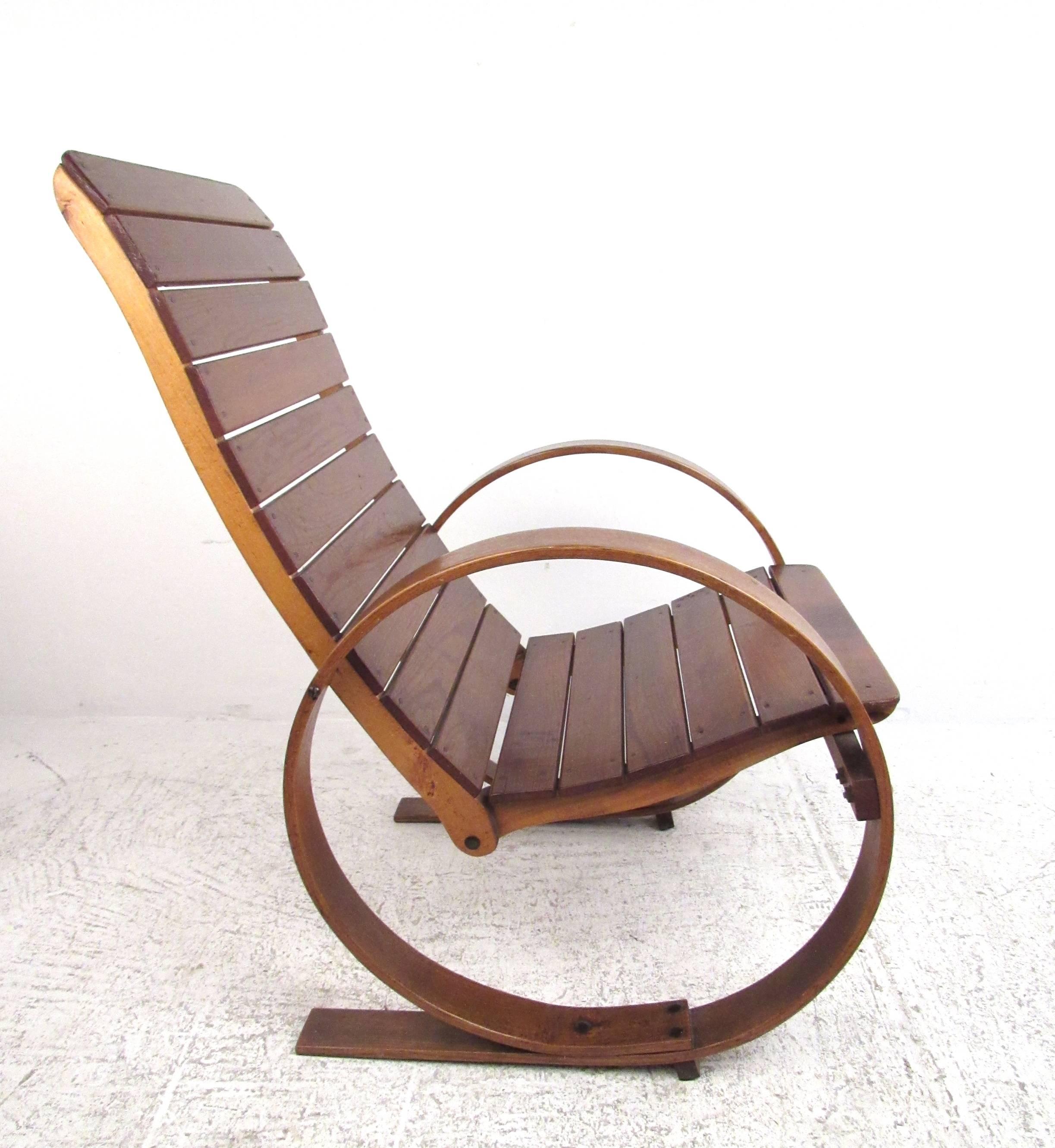 This unique vintage rocking chair features carefully crafted bentwood frame, with spring style circular rockers that double as armrests. Hardwood slat seat adds to the rustic vintage charm of this visually impressive rocker. Please confirm item