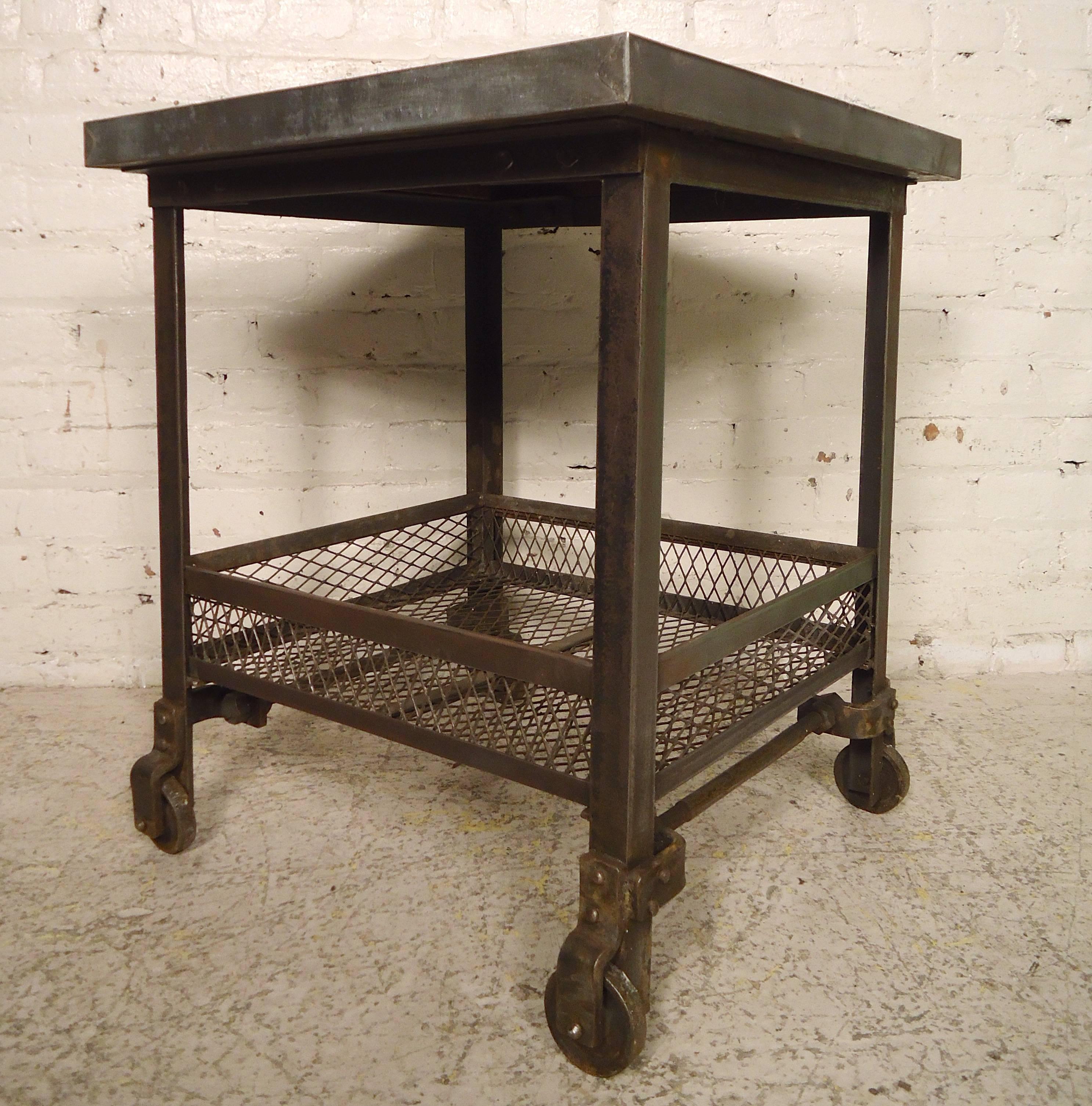 Heavy Industrial two-tier factory cart, with rolling casters. This has a great factory look and works as a side table or rolling cart.

(Please confirm item location NY or NJ with dealer).