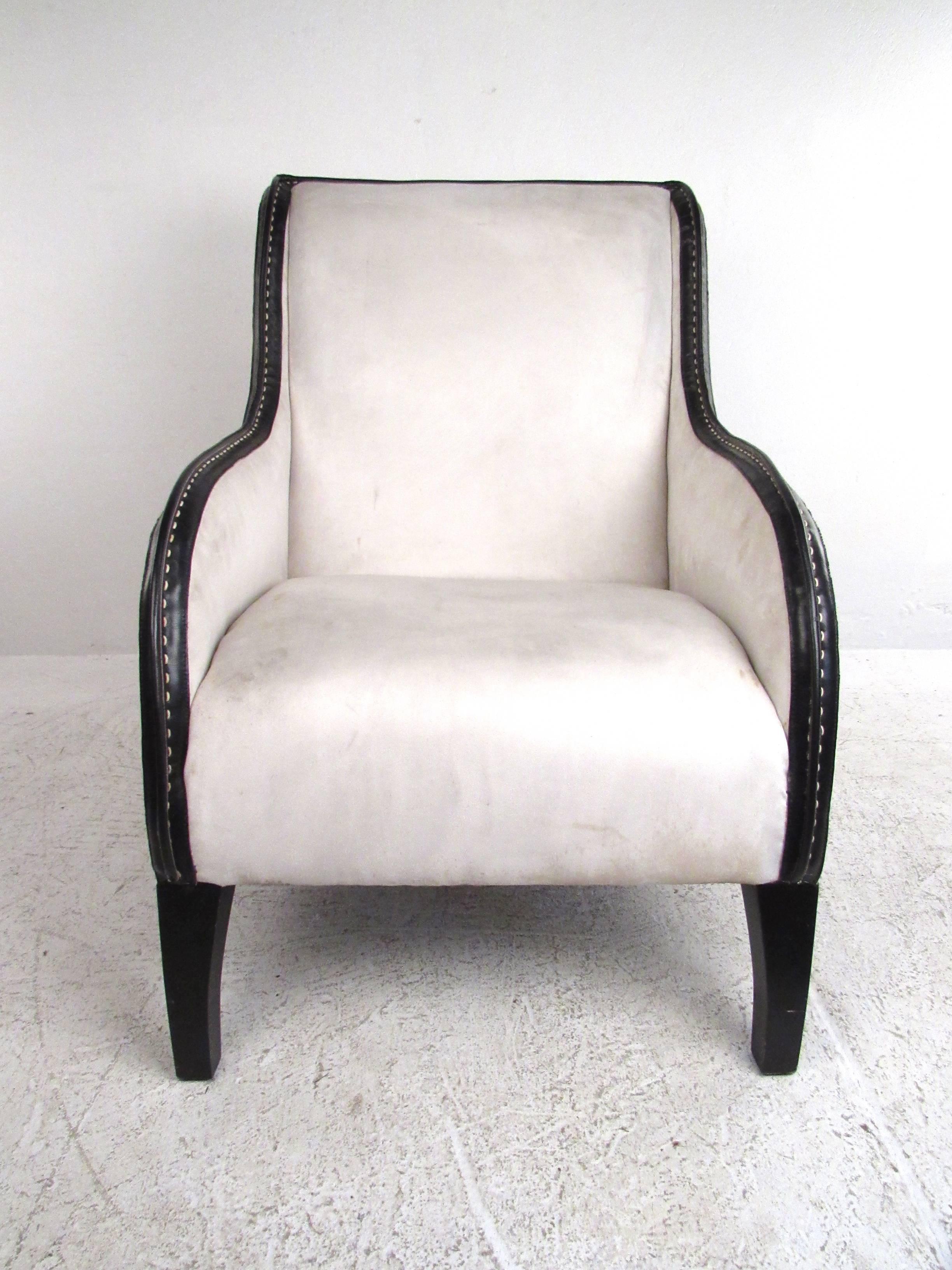 This stunning Italian style lounge chair features a stunning sculpted frame, complete with rounded high back seat and gradual leather trim armrests. The perfect mix of elegant design and timeless comfort make this unique armchair a wonderful
