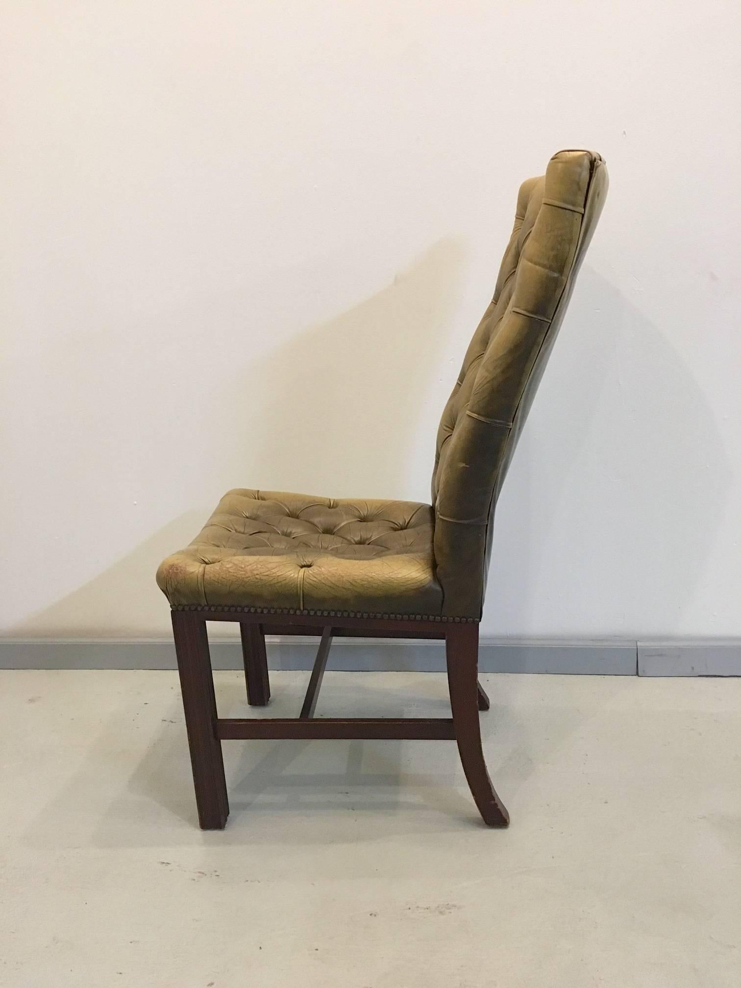 Four tufted high back chairs in leather with beautiful patina. Solid wood legs, buttoning throughout seat and back, fully upholstered around the back.

Item is in our New Hampshire warehouse and not available for viewing.
 