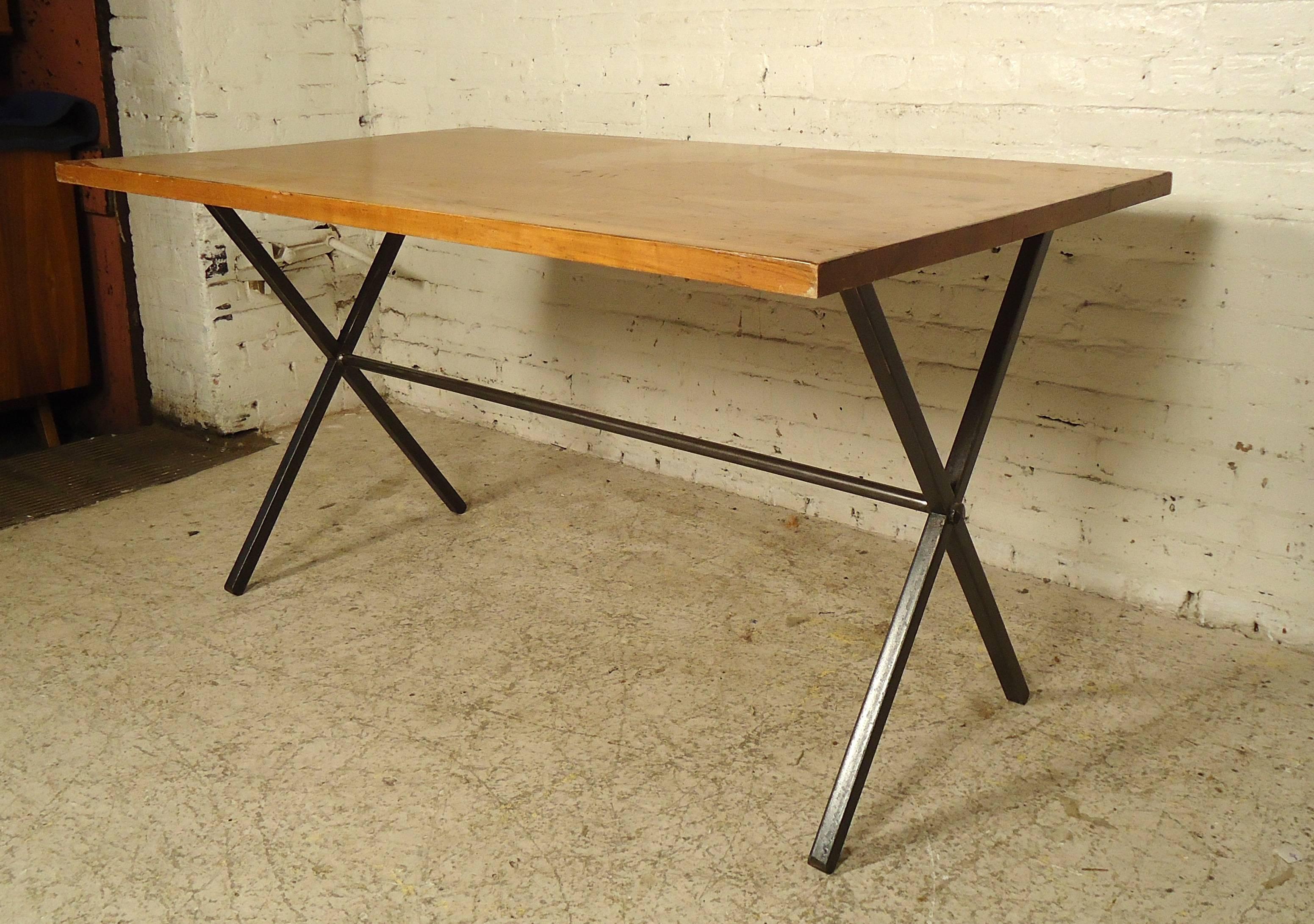This unique table features a hardwood top, Iron base sturdily supports the large rectangular top it's been paired with.

Please confirm item location (NY or NJ).