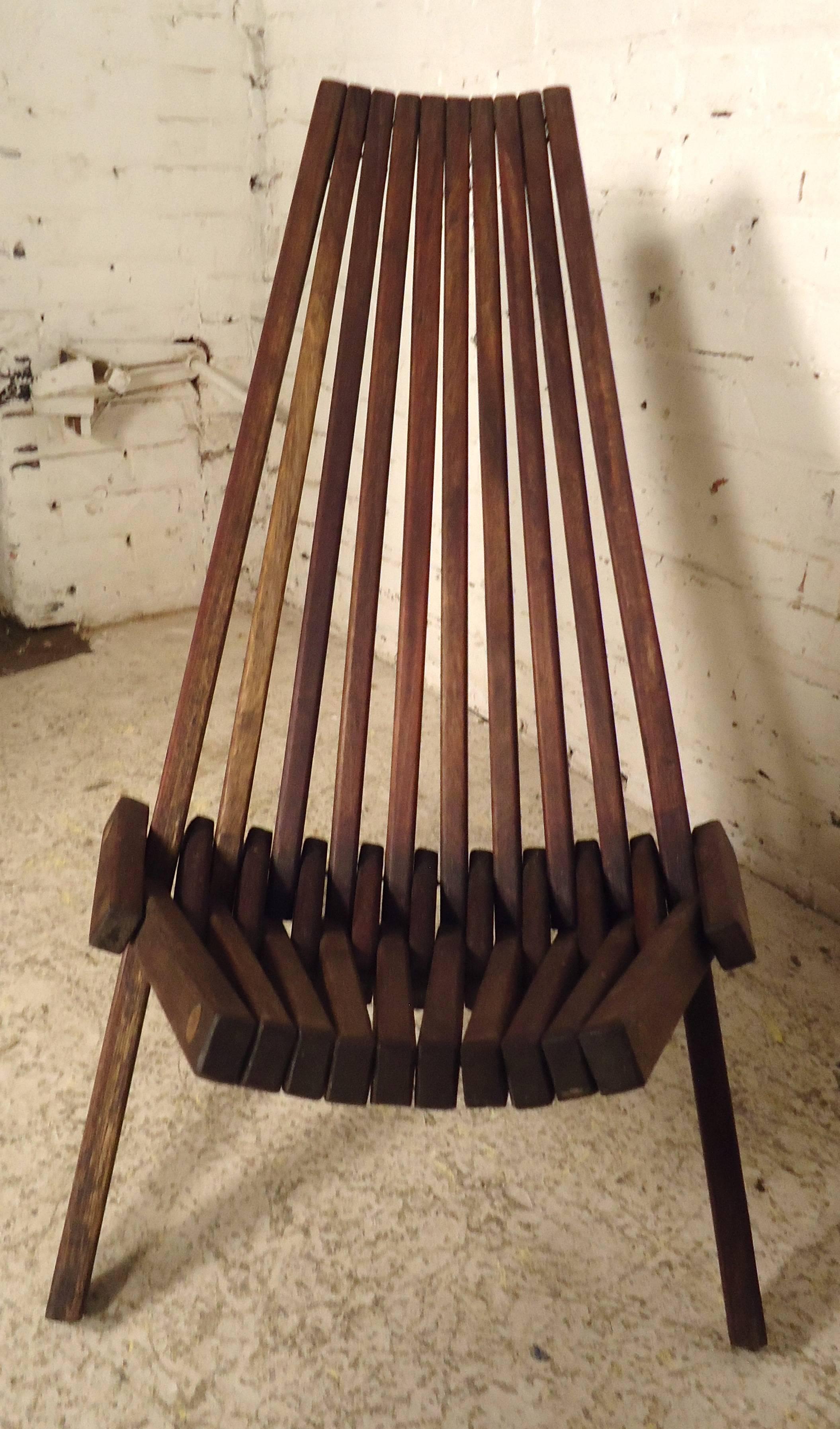 Pair of vintage folding chairs with teak slats. Unique angled form that folds up for easy moving.

(Please confirm item location - NY or NJ - with dealer).
       
