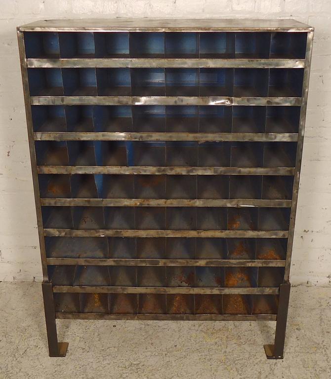 Unique factory storage unit, refinished in a bare metal style finish. Seventy plus units, solid feet, heavy duty industrial feel.

(Please confirm item location - NY or NJ - with dealer).
      