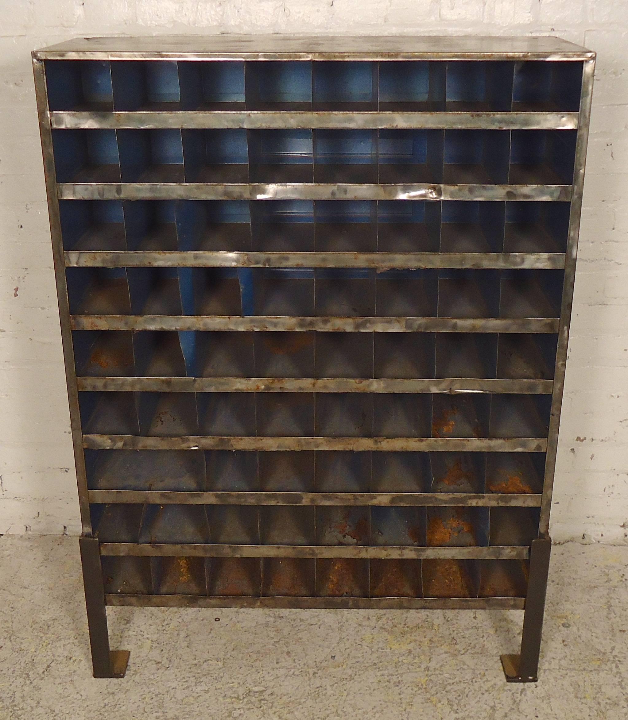 Unique factory storage unit, refinished in a bare metal style finish. Seventy plus units, solid feet, heavy duty industrial feel.
4