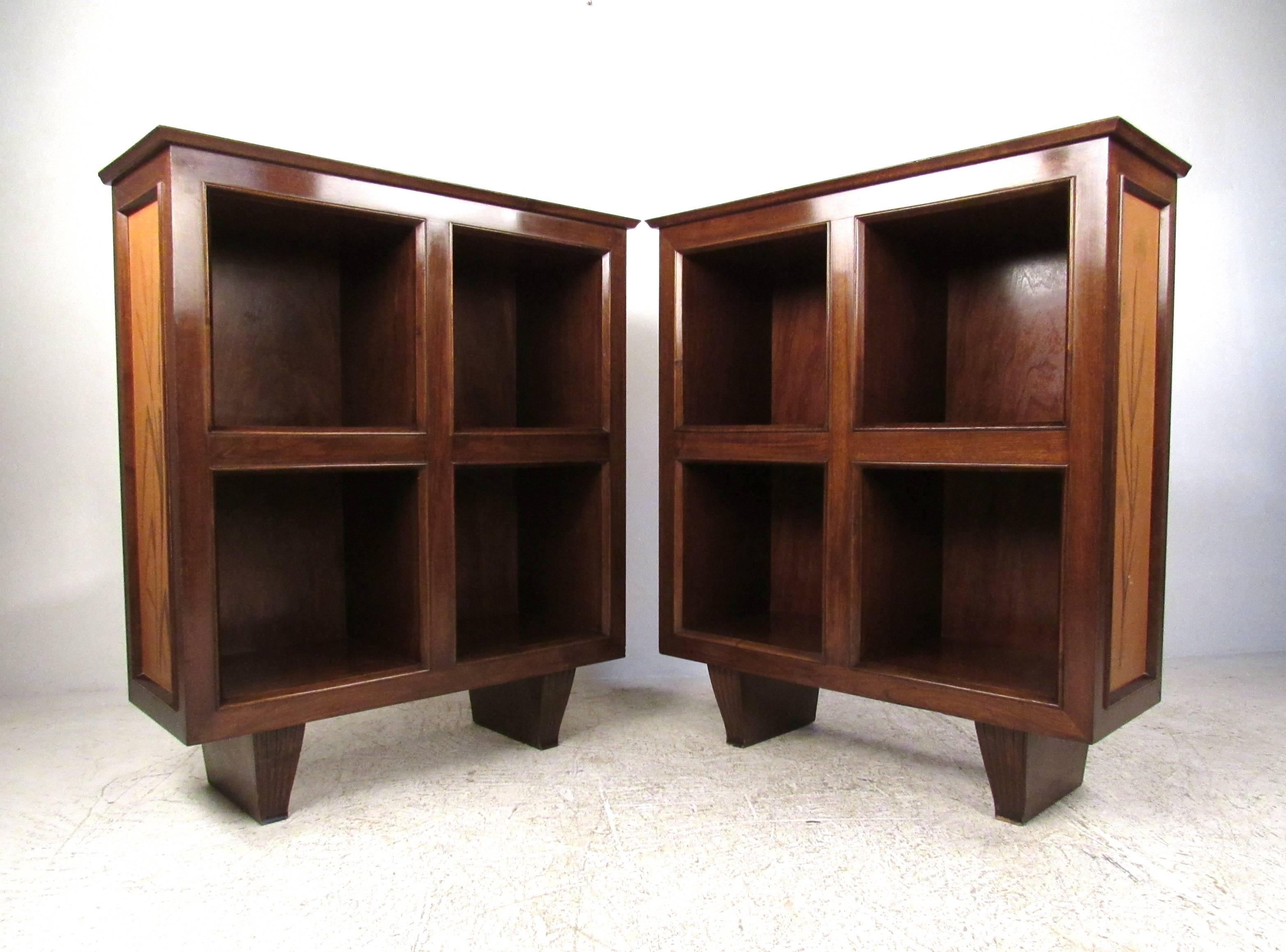 This matching pair of elegant walnut shelves features unique axe-head legs and subtle hand-painted illustrations on the sides. The rich finish of this set adds to the elegance, while the wide open shelves are ideal for storage or display. Please