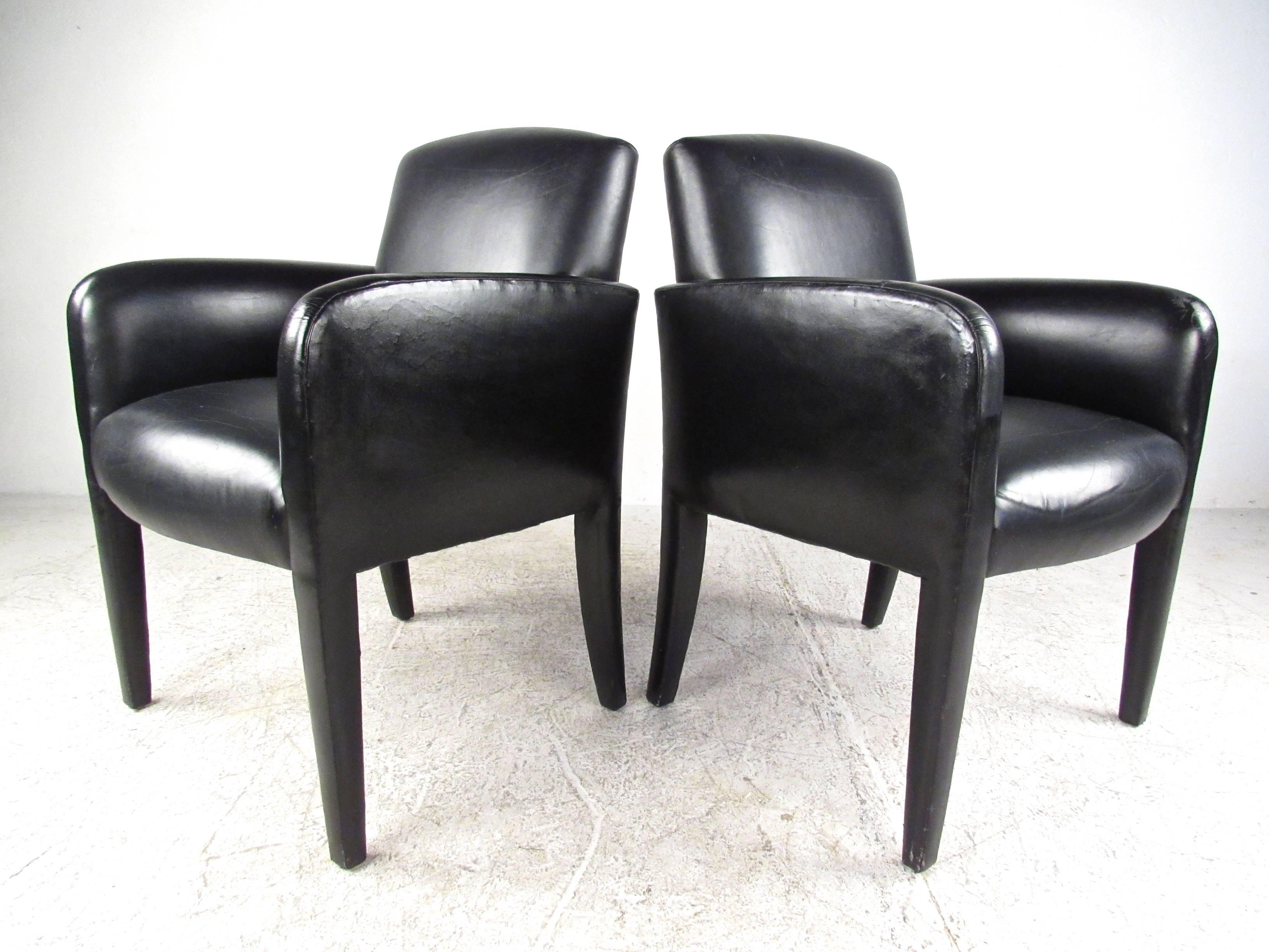 This attractive pair of modern Italian side chairs feature stylish leather upholstered frames and make a stunning addition to any seating area. An extremely comfortable lounge chair with thick padded seating. Perfect chairs for home or office use,