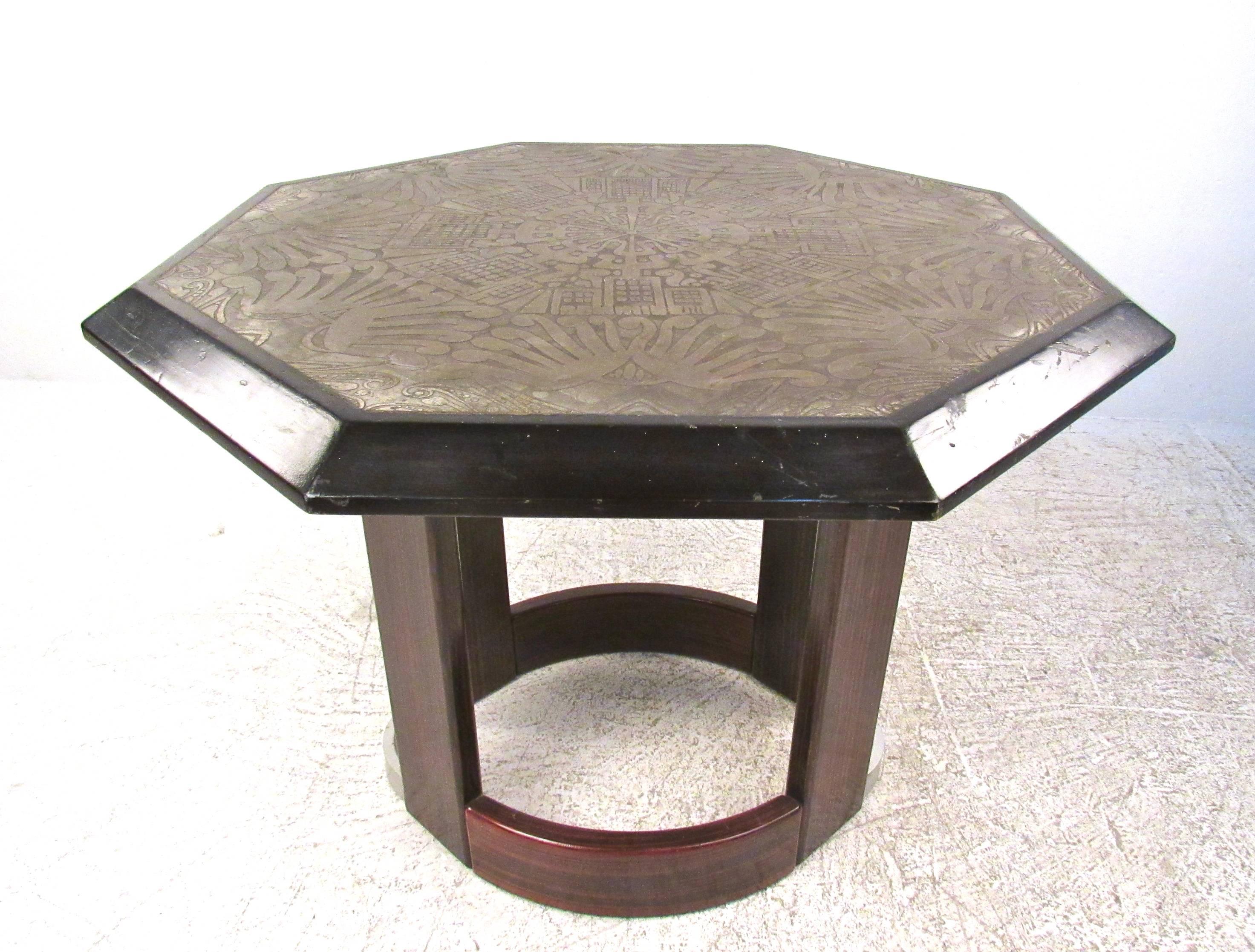 This unique Italian table features an impressive raised design top with unique design. Whether on display in the foyer, sitting room, or entryway this octagonal center table with stylish pedestal base makes an impressive addition to any setting.