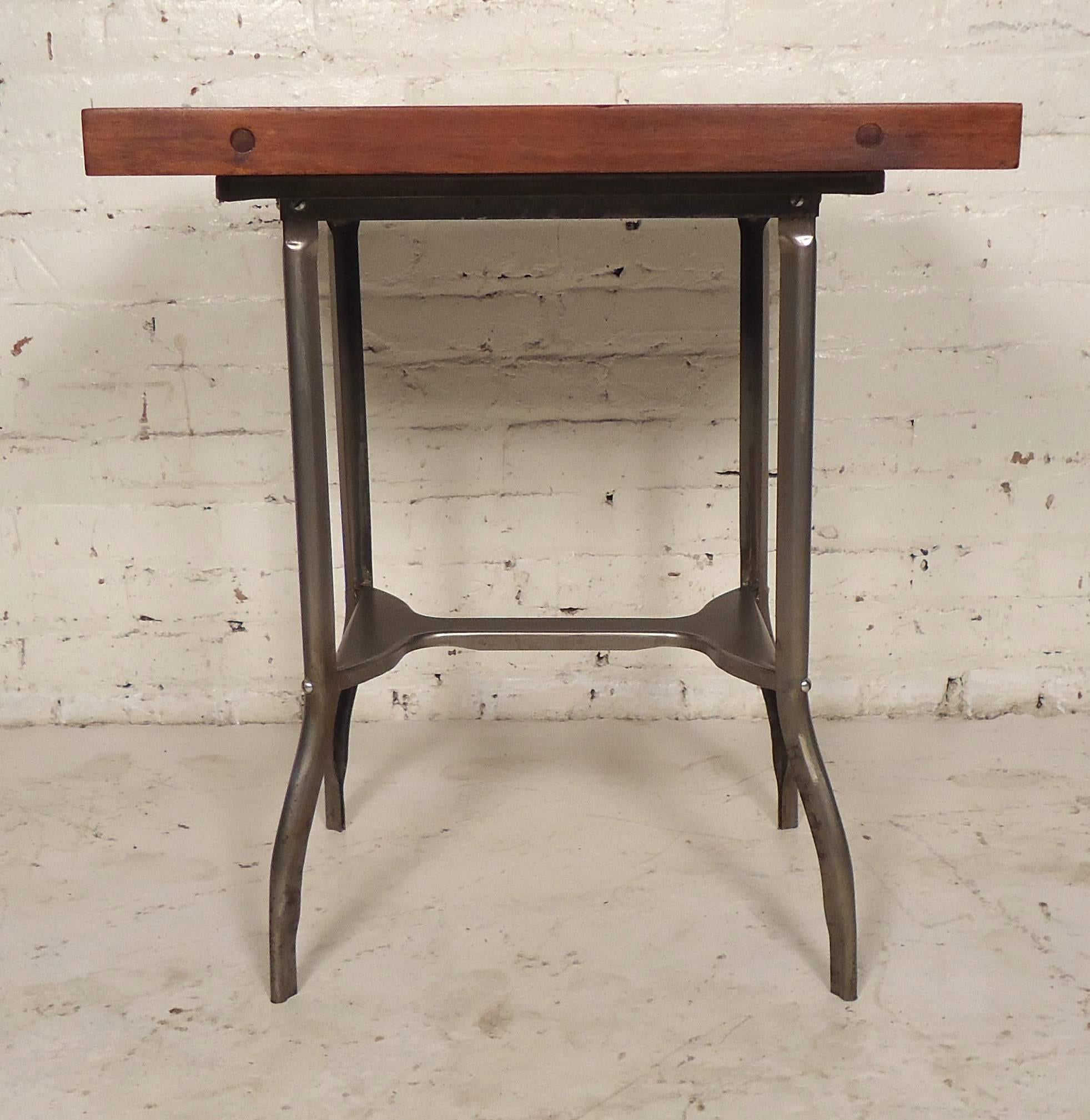 Restored work table with stripped sturdy metal base and wood top. The wood has been stripped down, sanded, and given a clean finish.

(Please confirm item location- NY or NJ with dealer).