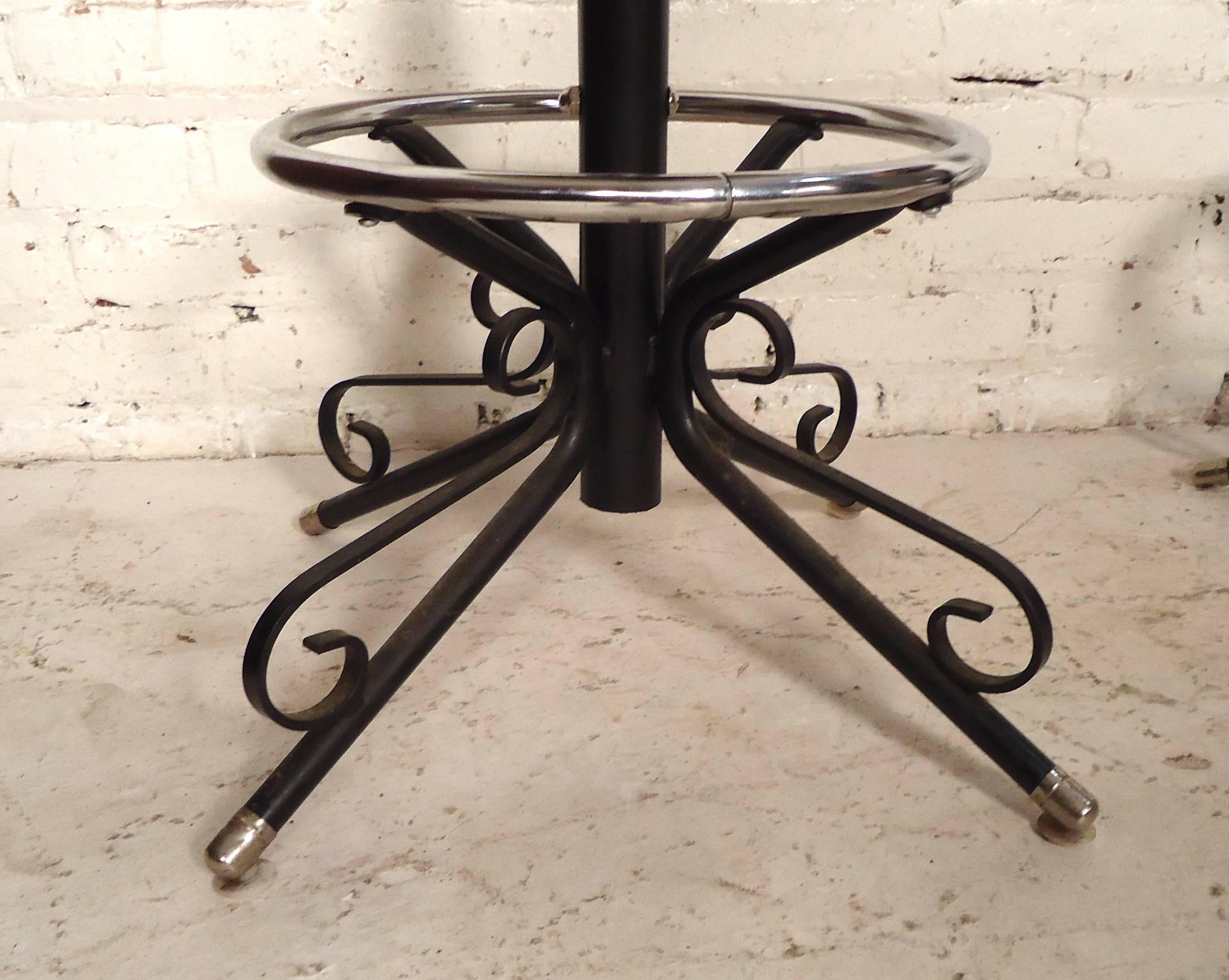 Three swivel stools with a strong iron frame desgined by Arthur Umanoff for Shaver Howard's 