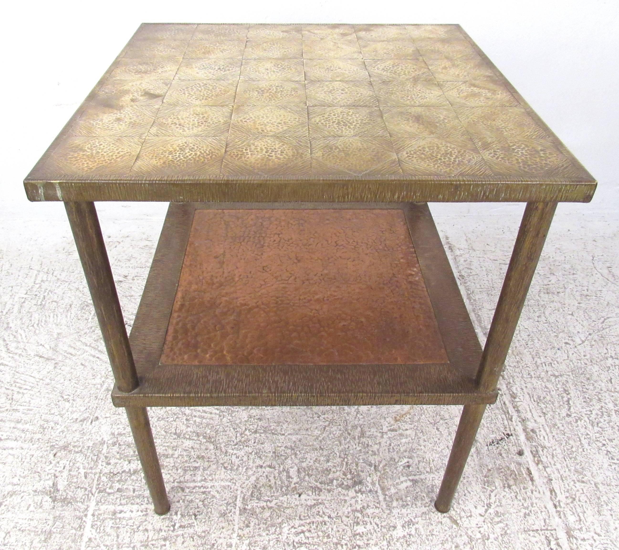 Stunning Mid-Century two-tier occasional table features unique textured brass top with an embossed diamond pattern. This vintage end table makes an impressive addition to any interior. Please confirm location with dealer (NY or NJ).