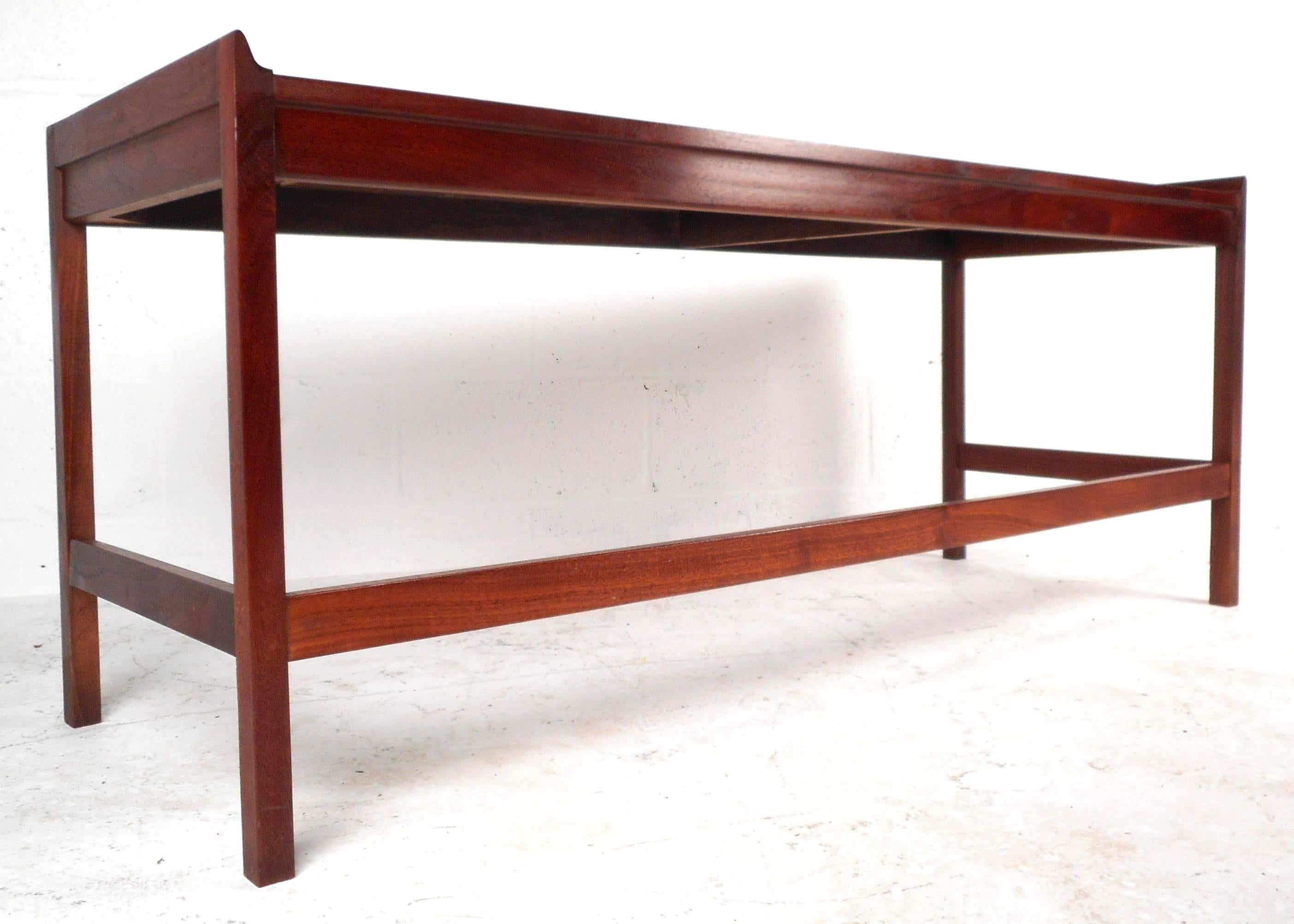 Mid-century Modern console table with raised edges and vintage walnut finish. Perfect for entryway, behind sofa or hall way. Please confirm item location (NY or NJ).