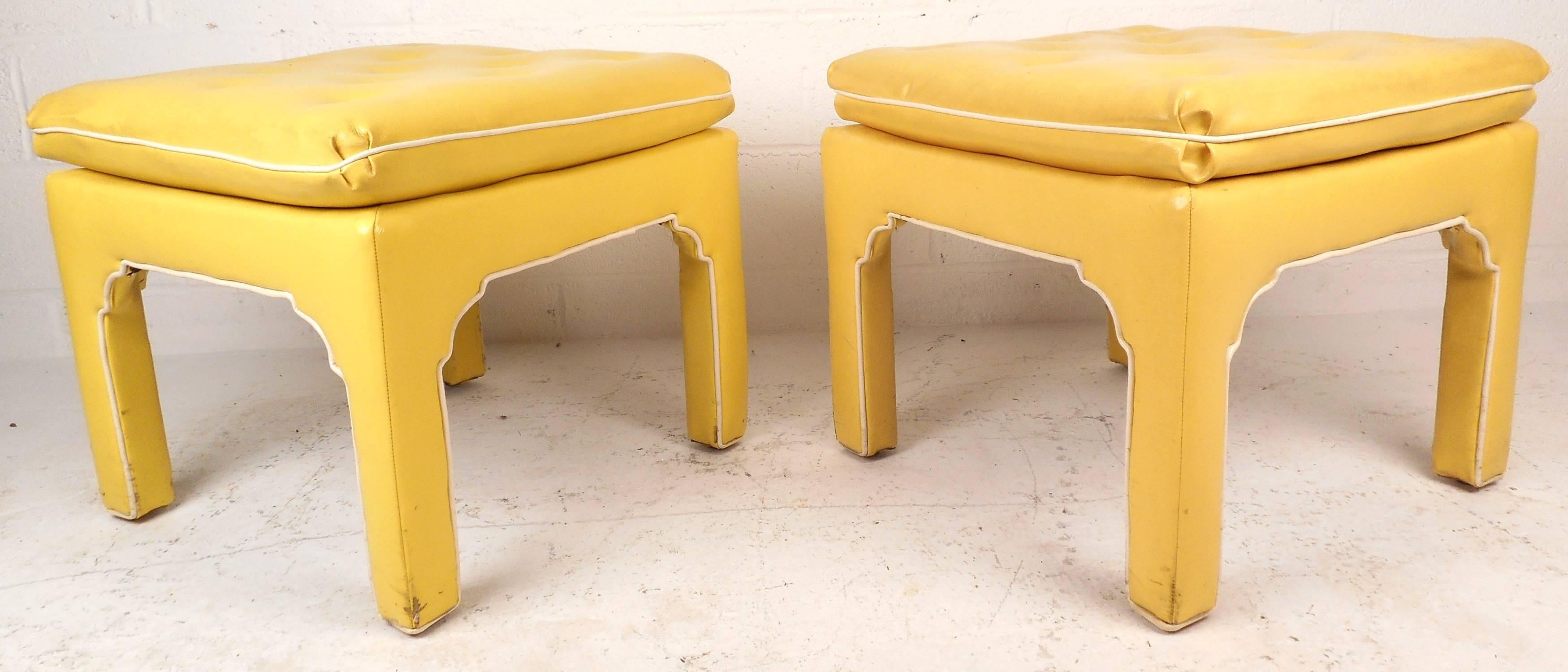 Elegant vintage modern pair of tufted Parson's style ottoman's with unique sculpted sides. Sleek design covered in elaborate yellow vinyl and a thick padded top for maximum comfort. This unusual pair of poufs make the perfect addition to any home,