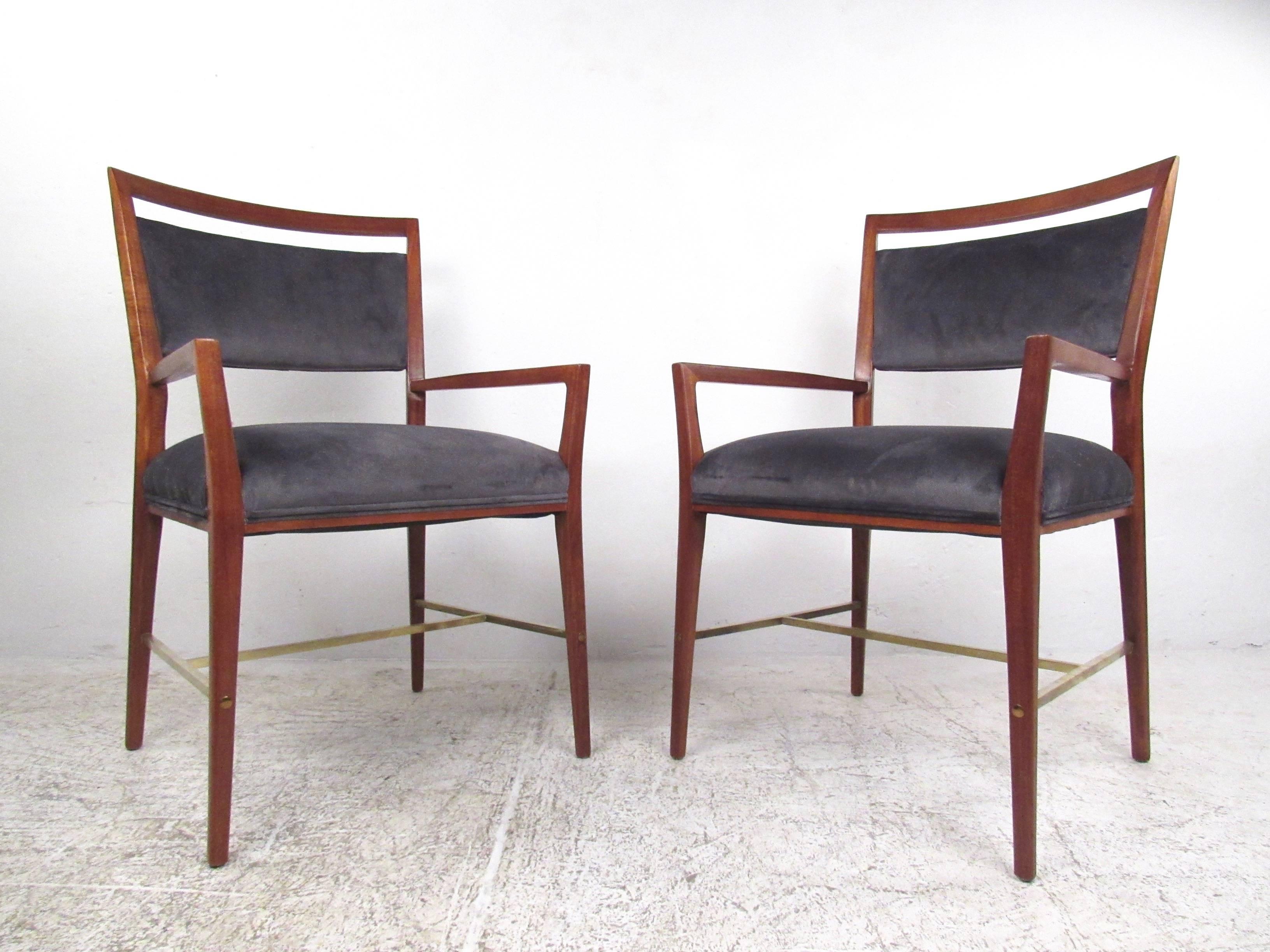 These stunning vintage chairs feature uniquely tapered hardwood frames, brass stretchers, and comfortable upholstered seats and backs. This Classic mix of comfort and Mid-Century style makes these Paul McCobb armchairs an impressive addition to any