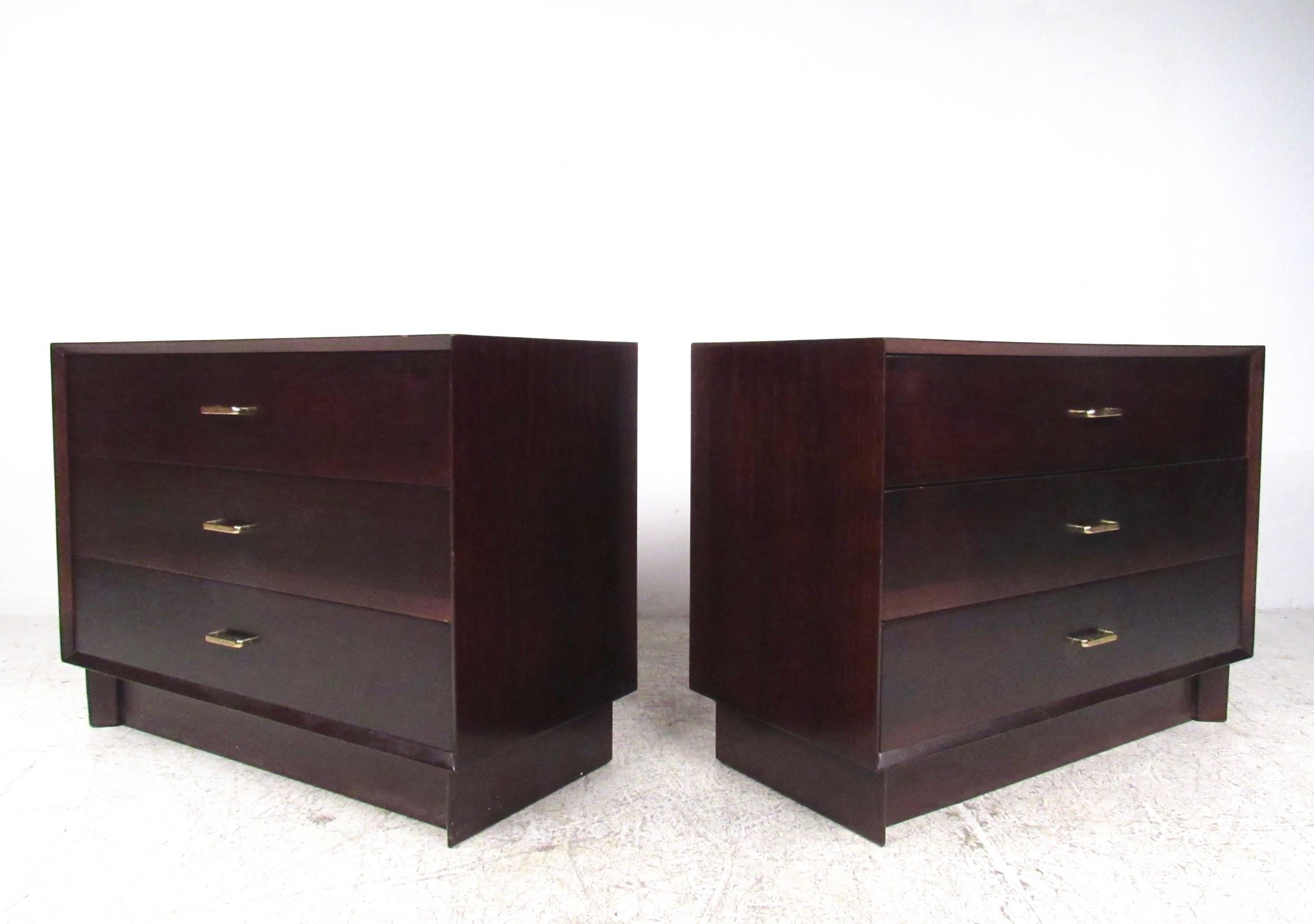 This unique pair of vintage modern bachelor's chests features mahogany construction with textured brass finish drawer pulls. Perfect matching pair for use as oversized bedside tables or storage dressers in any setting. Please confirm item location