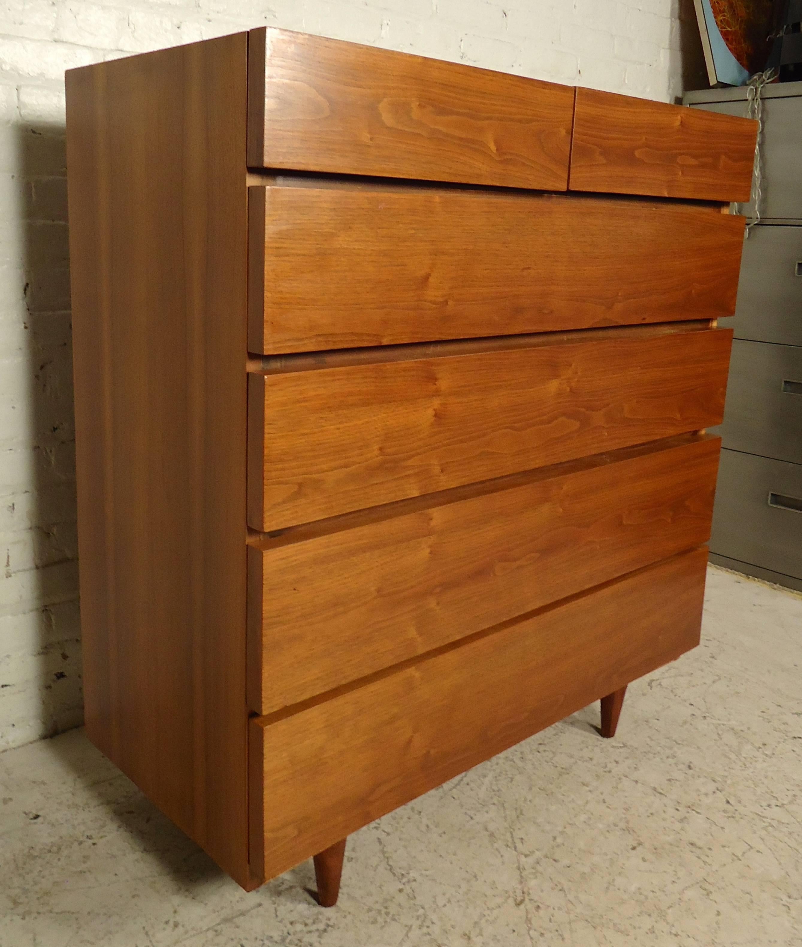 This beautiful vintage modern walnut dresser features four drawers below two small top drawers. Very Classic refinished high boy set on tapered legs.

Please confirm item location (NY or NJ) with dealer.