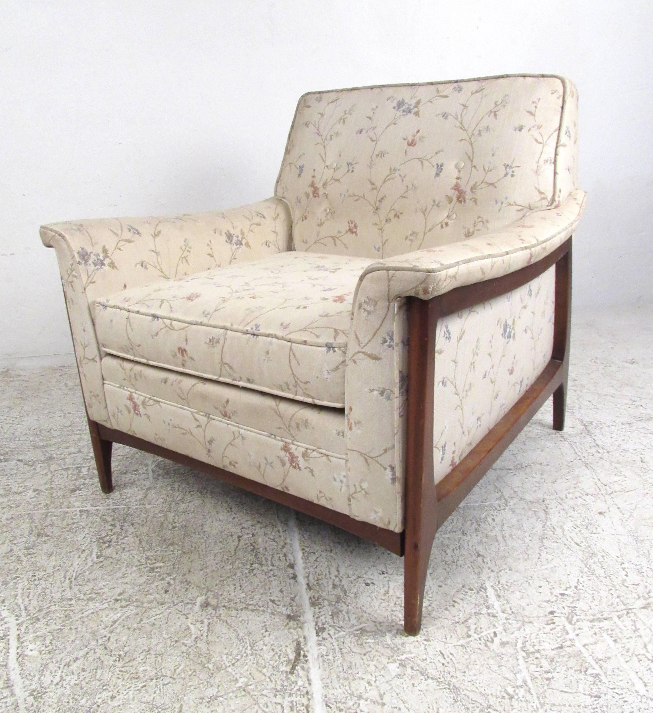 This Mid-Century Modern lounge chair features unique Adrian Pearsall style design. Vintage floral upholstery is wonderfully complimented by the natural walnut finish, while the plush upholstery makes this a comfortable addition to any setting.