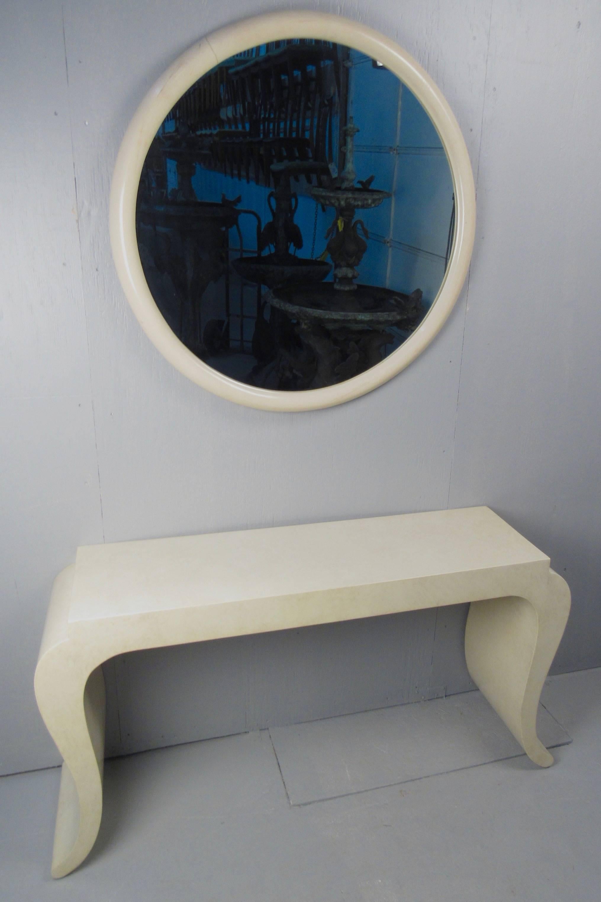 This matching mirror and hall table make a stylish contemporary modern display in any home or business. This stylish vintage table is ideal for hall or entryway use. Two tone cream finish is accented by cut away table top and scrolled legs. Please