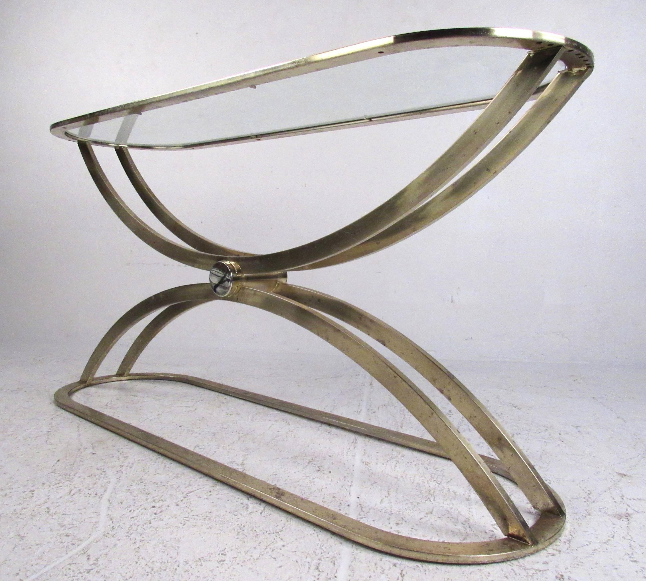 This vintage modern console table features a sculpted brass finish base with rounded edges and unique details. Wonderful Mid-Century brass finish makes this an elegant console or sofa table, perfect for use in hall, entryway, or showroom. Please