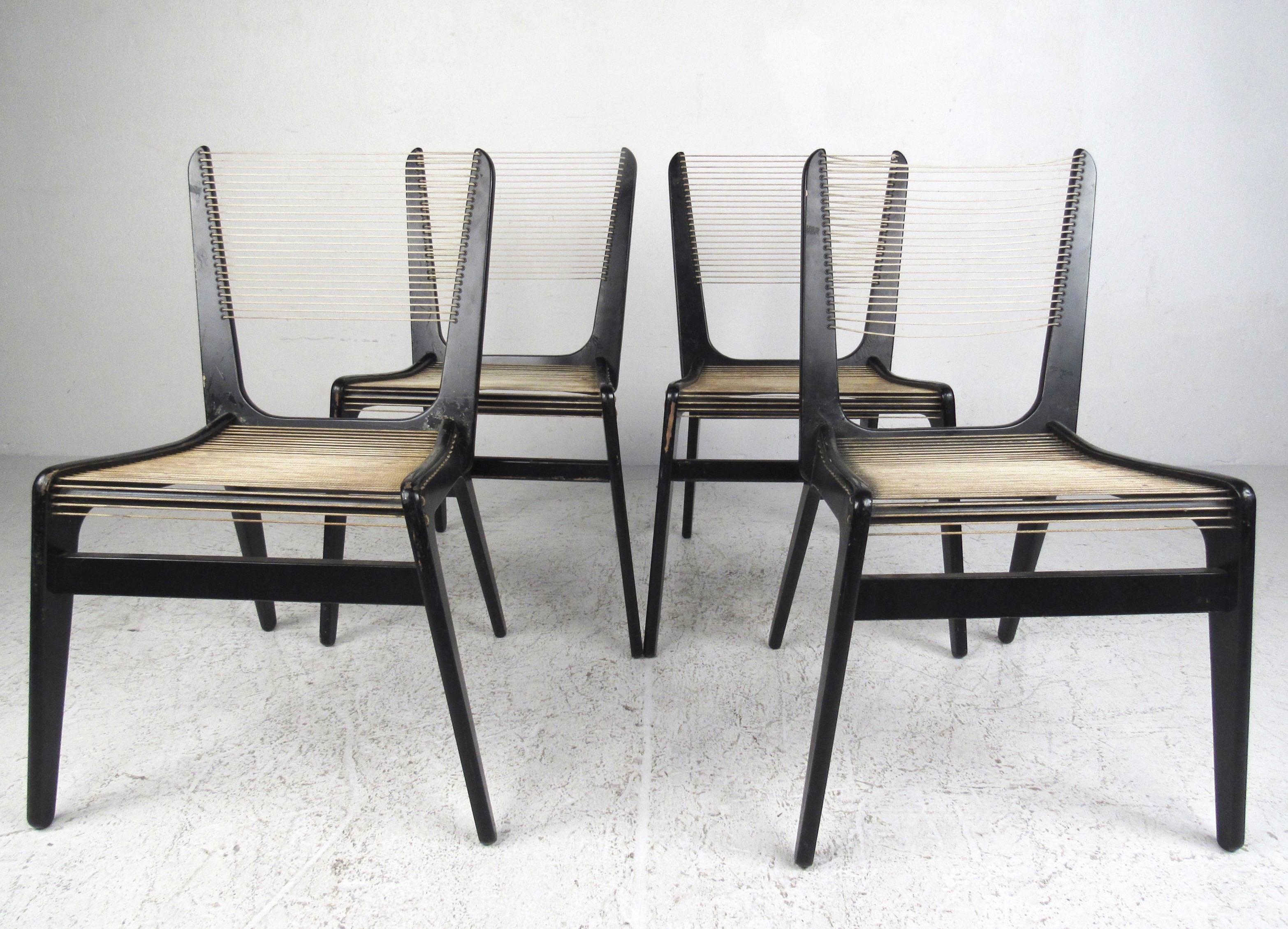 This rare set of Mid-Century Modern dining chairs by Jacques Guillon features black lacquered wooden frames with rope cord seat and back. Stylish vintage design makes these unique string chairs an unusual and impressive addition to any dining room