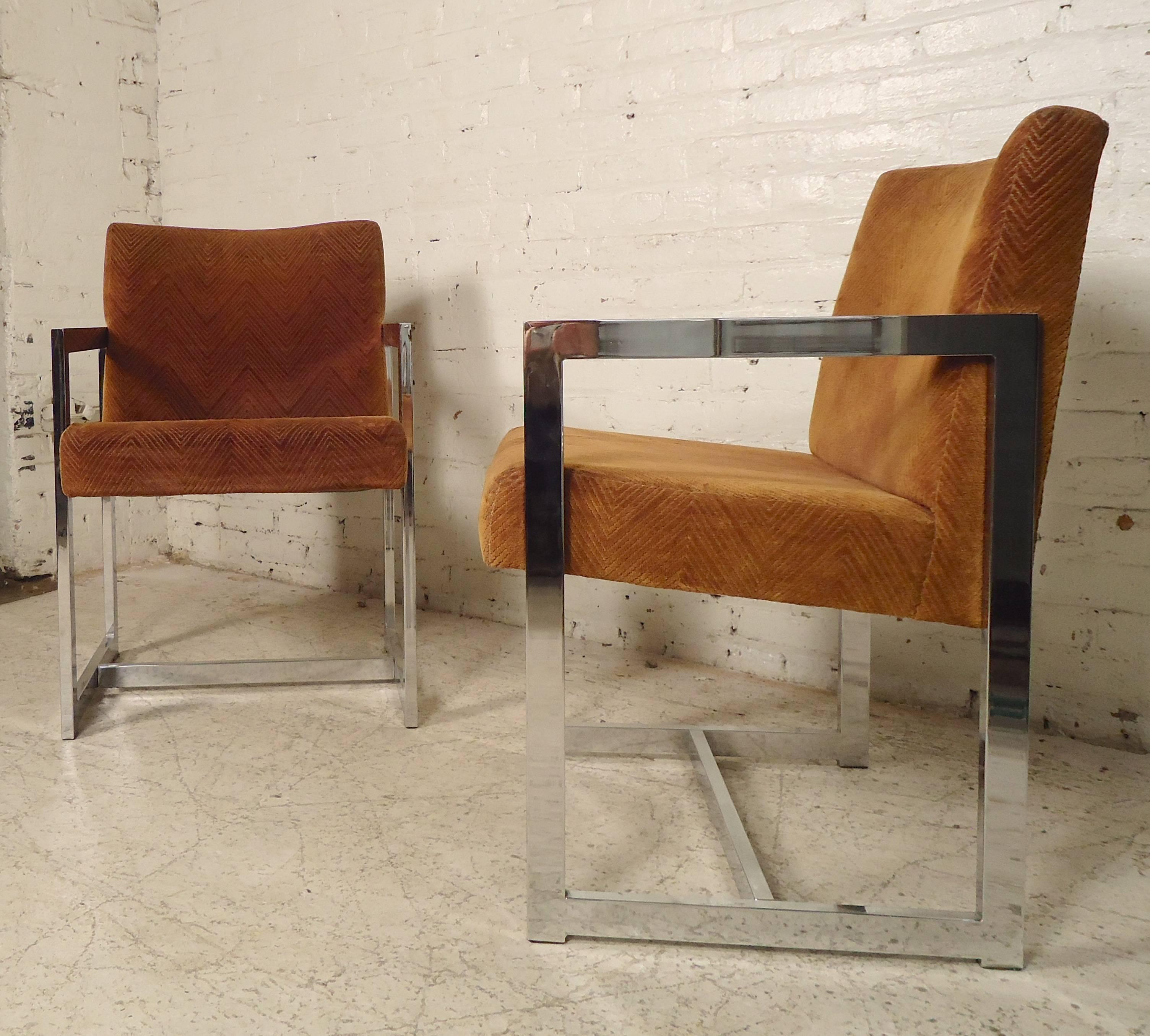Pair of angular chrome frame armchairs with a 