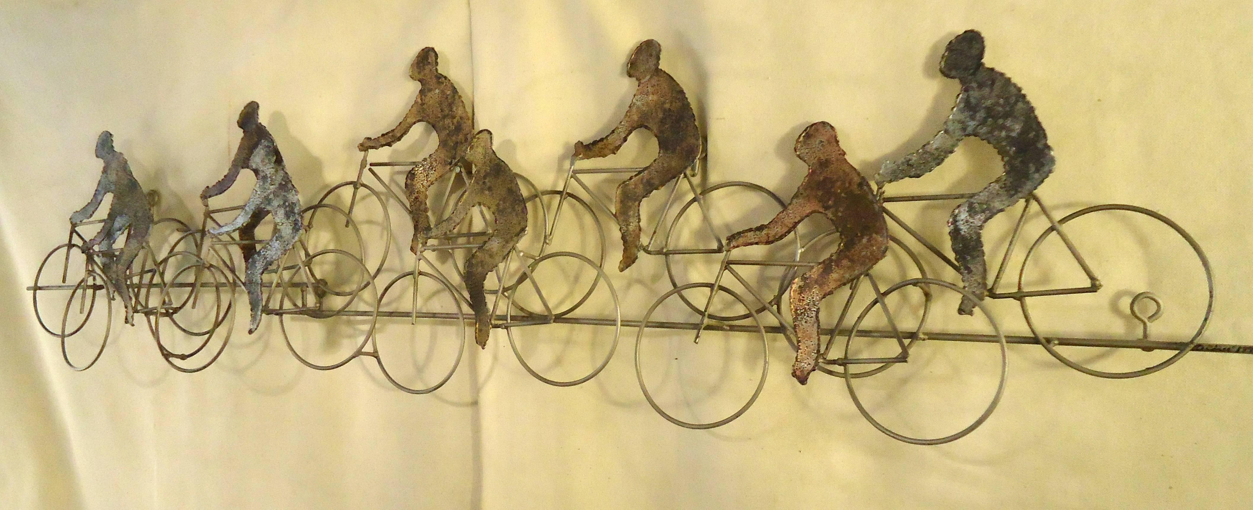 Beautiful abstract wall hanging by Curtis Jere, depicting a bicycle race. Made from torch cut metal, assembled in a three dimensional pattern.

(Please confirm item location - NY or NJ - with dealer).
 