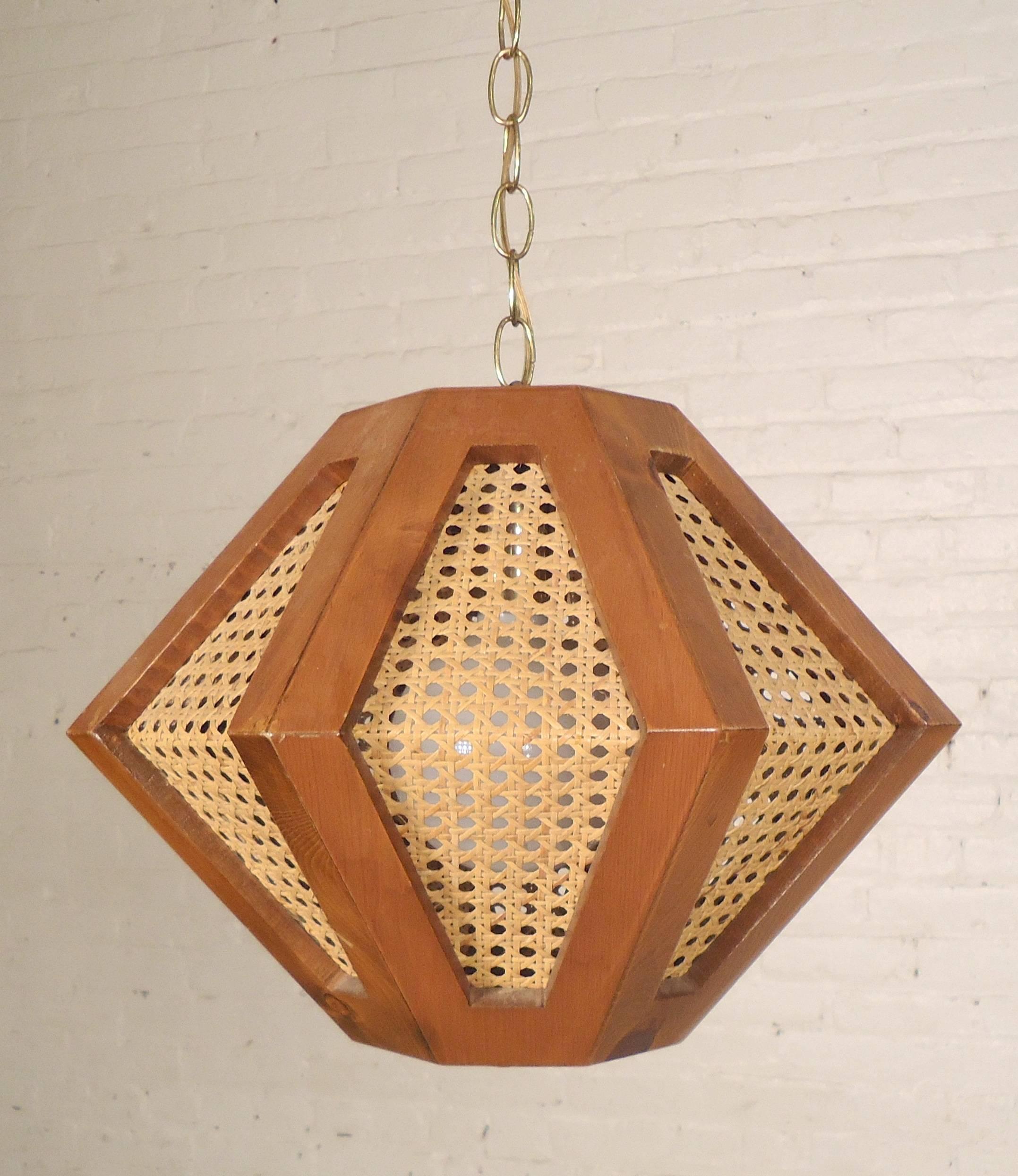 Vintage hanging lamps with an octagonal walnut frame and woven screens. Any amount of chain can be added to subtracted. White glass globe sits over the bulb. Price is for one.

(Please confirm item location - NY or NJ - with dealer).
  