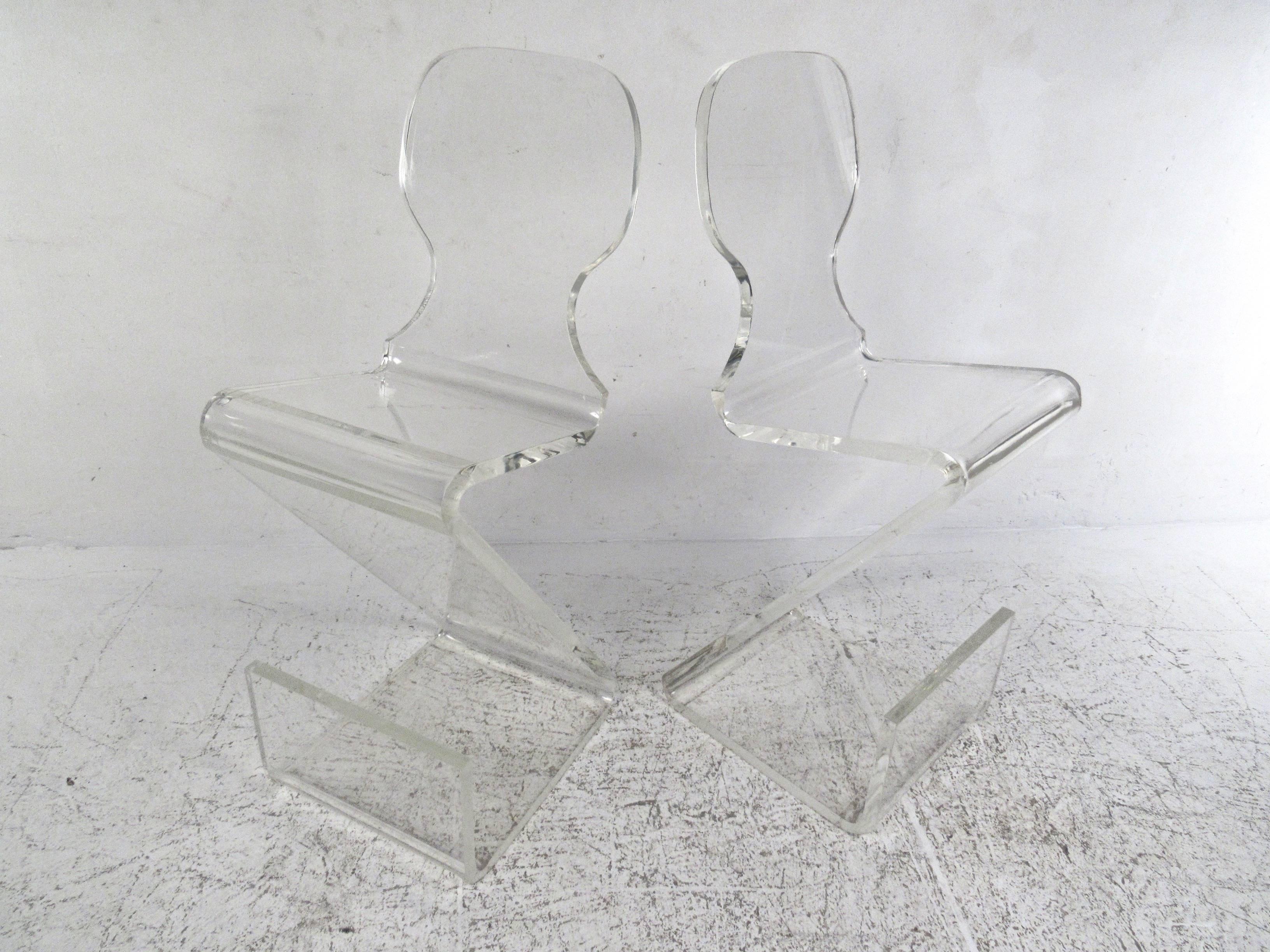 This pair of vintage Z-style stools feature unique sculpted Lucite construction with cantilever base and stylish modern lines. This Gary Gutterman design makes a wonderful addition to home or business bar or counter display. Please confirm item