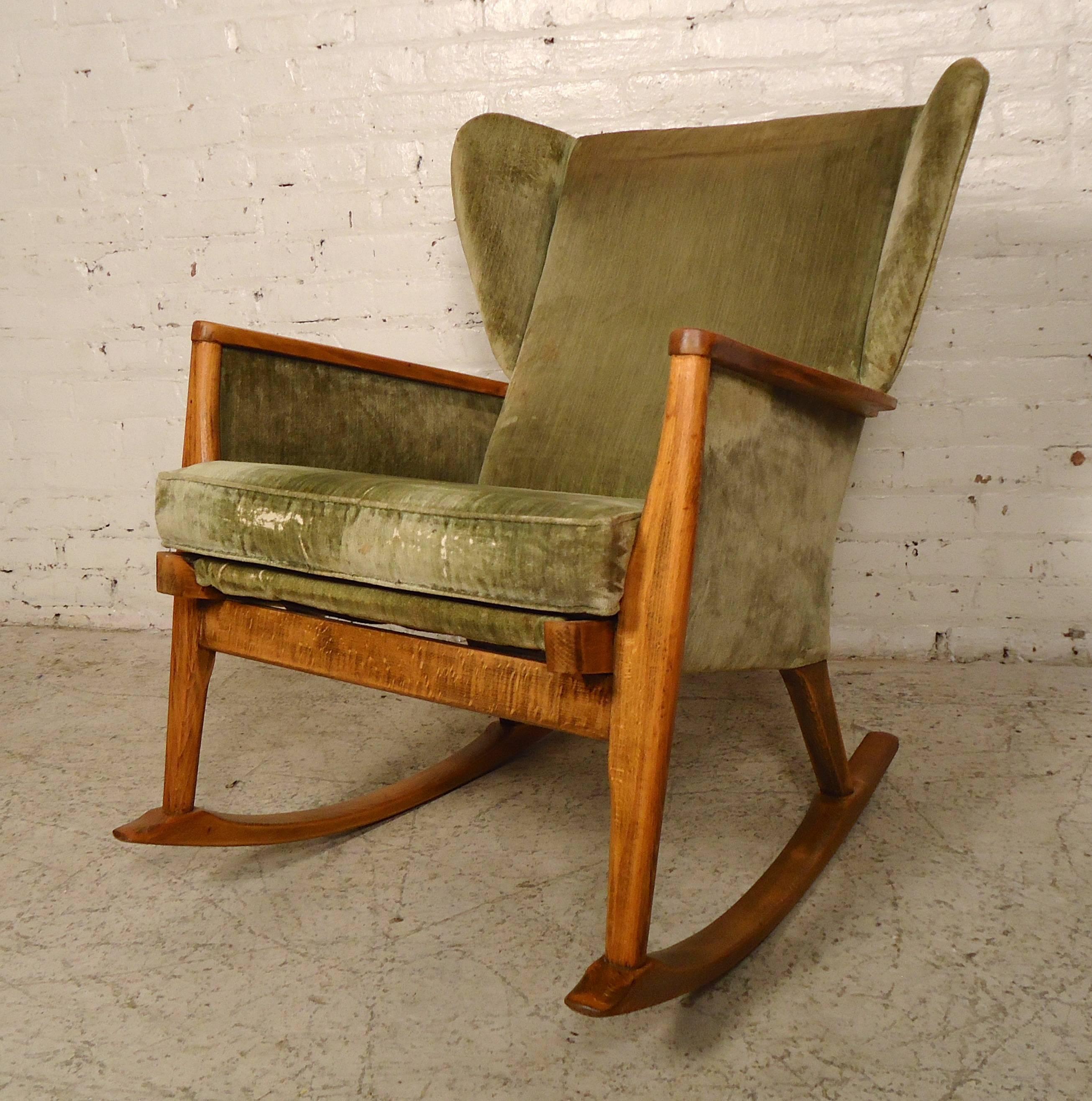 This unique rocker designed by Parker Knoll features a cushioned seat, light wood frame and wing back style back rest. Exposed wood frame has been refinished to give a nice accent.

(Please confirm item location - NY or NJ - with dealer).