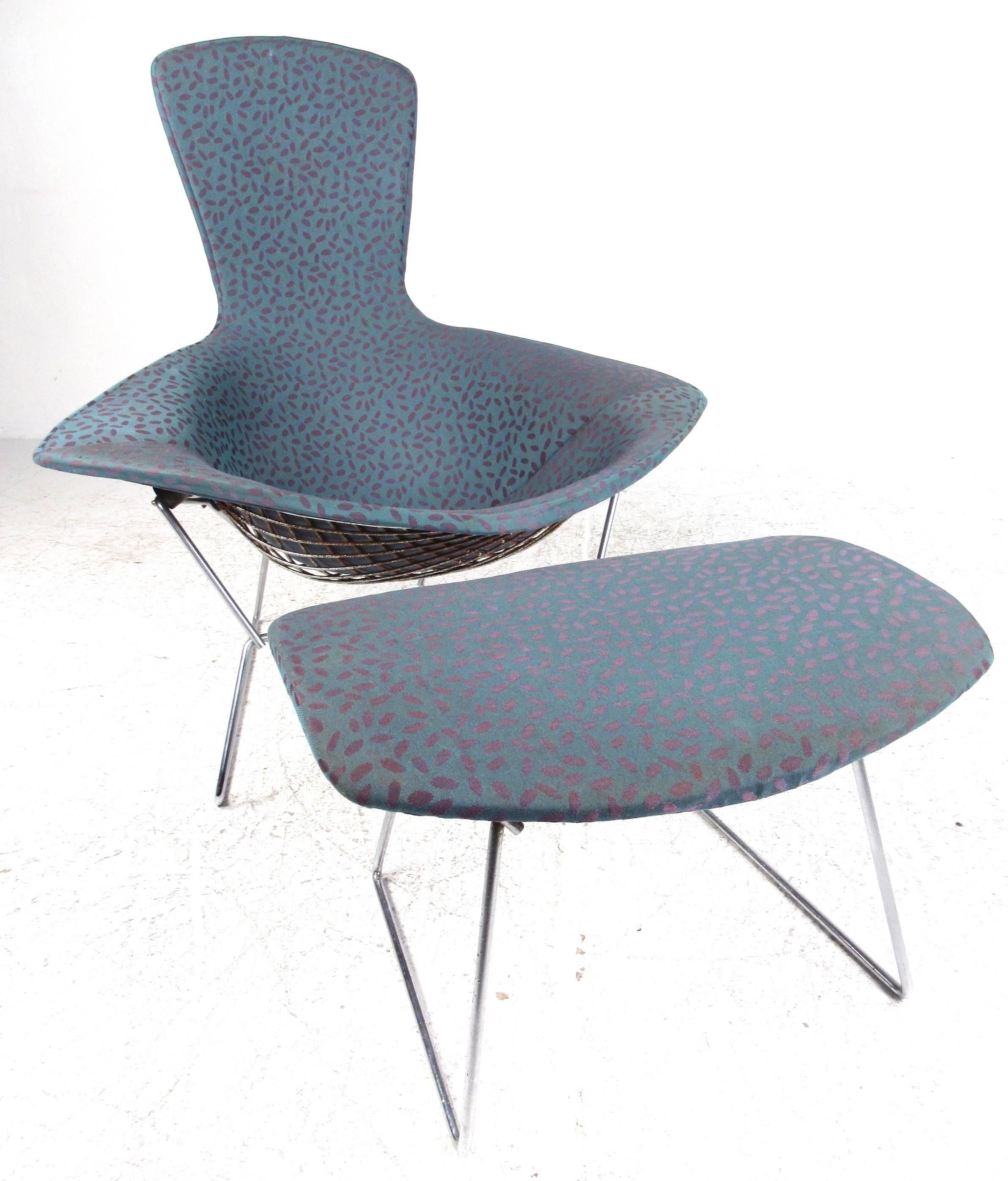 This Mid-Century Modern sculptural metal lounge chair designed by Harry Bertoia for knoll comes complete with matching ottoman. Stylish modern design set apart by unique angles and comfortable ergonomic seat shape. Vintage fabric covering lightly